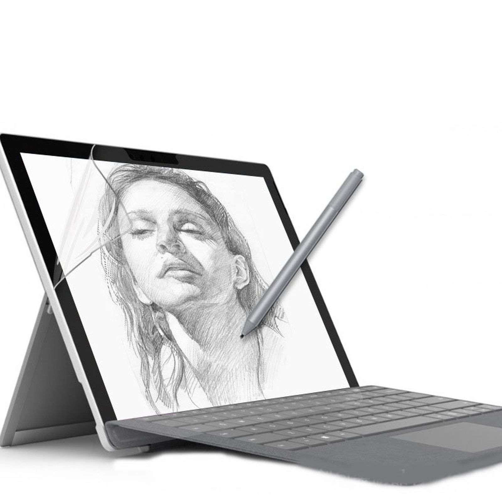 Laptop con disegno di volto femminile, stilo e tastiera su superficie bianca.