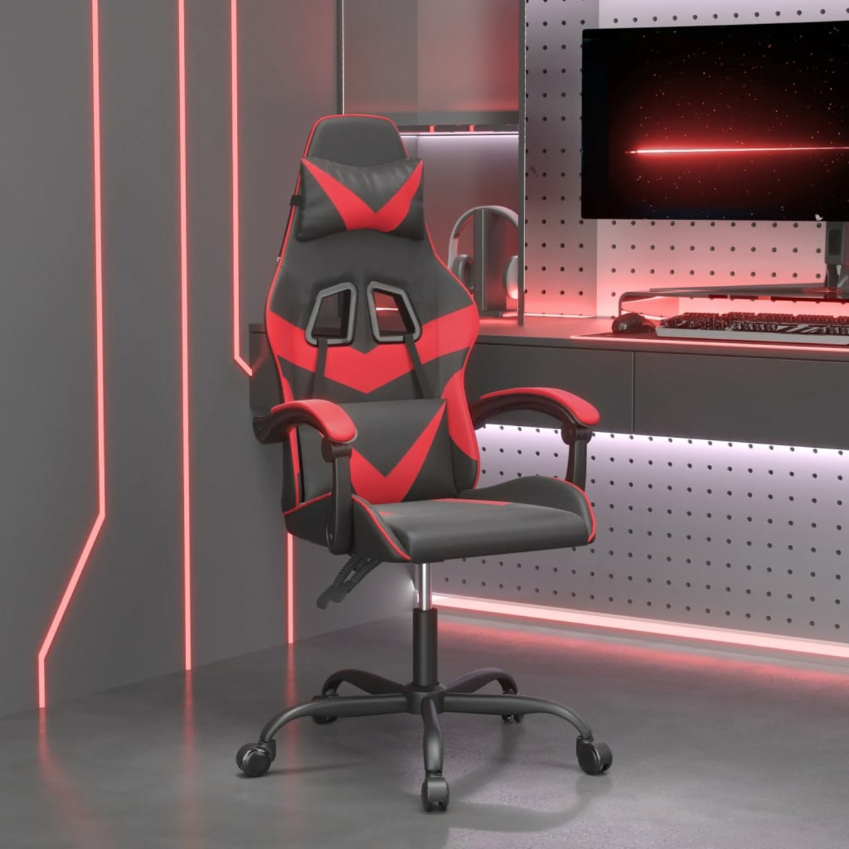 Gaming-Stuhl mit roten und schwarzen Details. Er steht in einem grau getäfelten Raum. Im Hintergrund ist ein Computerbildschirm.