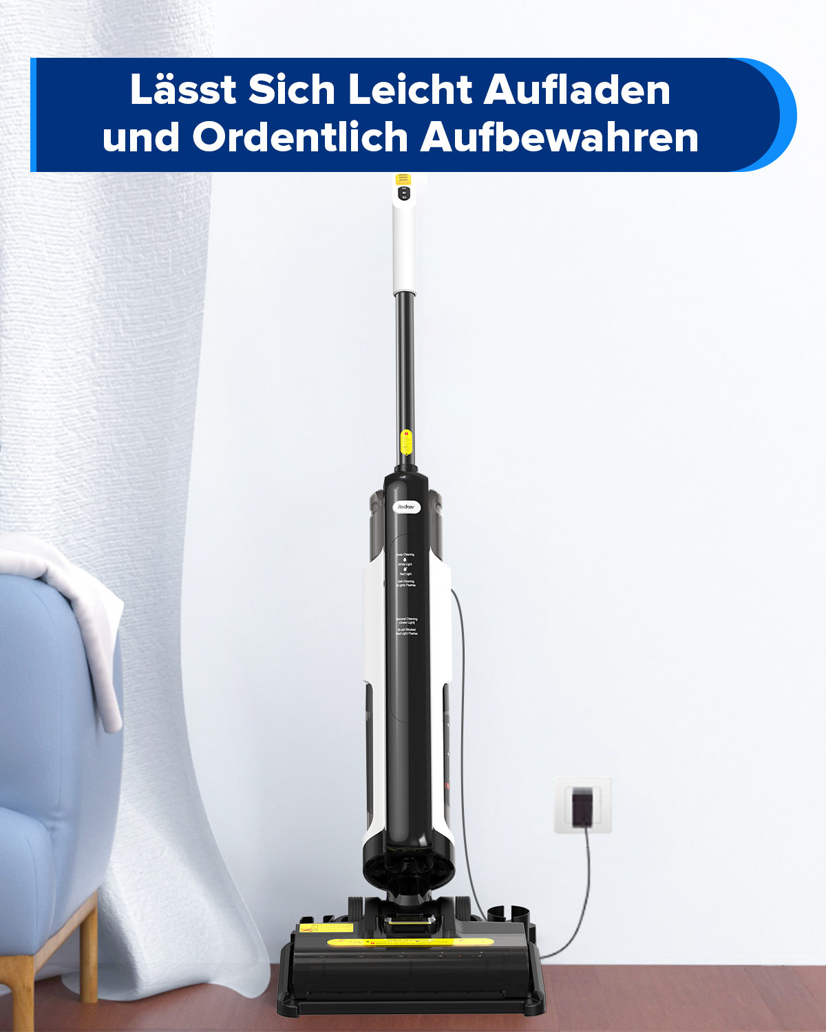 Czarno-biały odkurzacz z bazą ładującą, stojący na drewnianej podłodze.