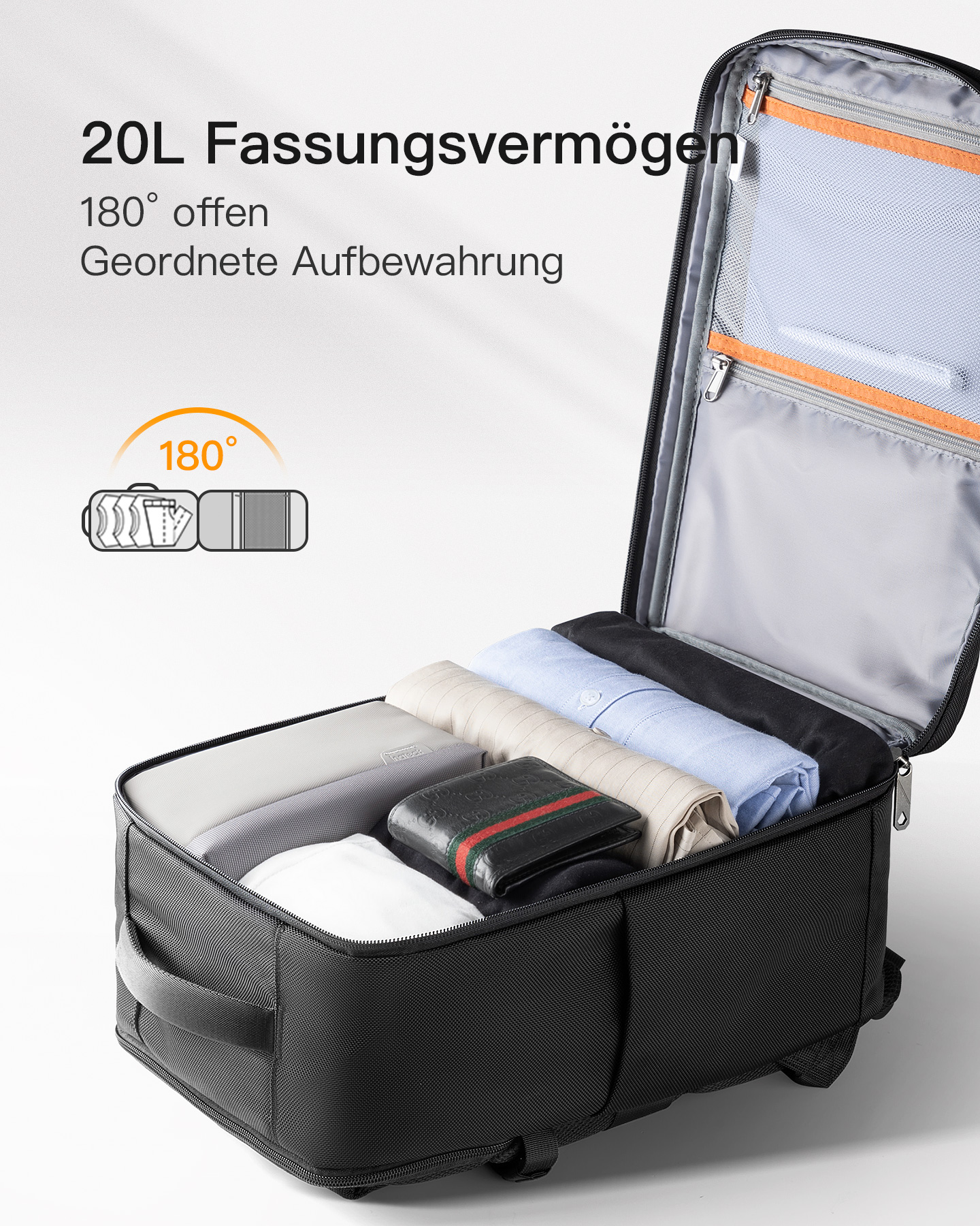 Offener schwarzer Reisekoffer mit Kleidung, Geldbörse und anderen Gegenständen.