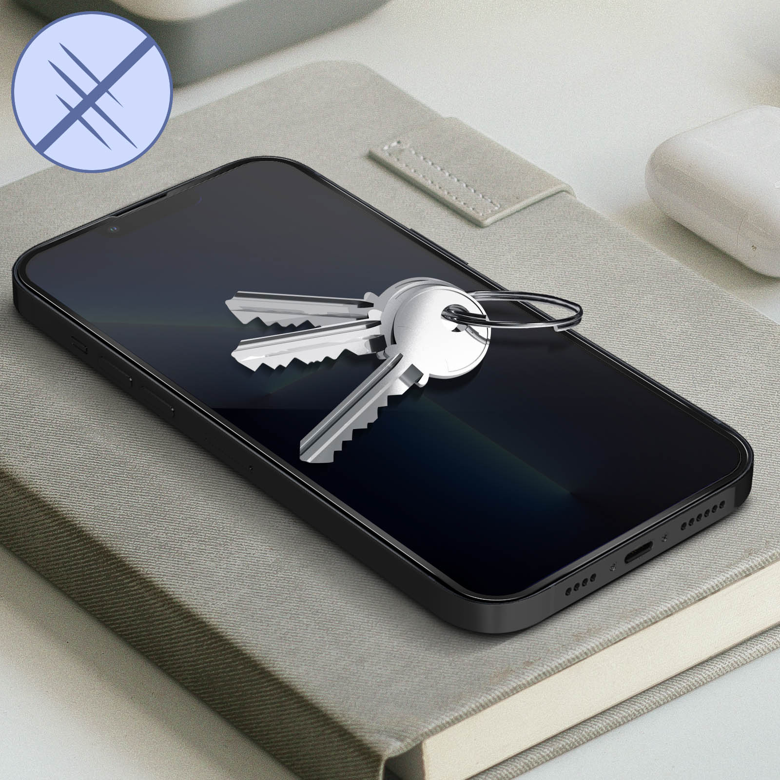 Smartphone con chiavi sullo schermo. Una protezione per lo schermo è sul telefono e un'icona di graffio è presente.
