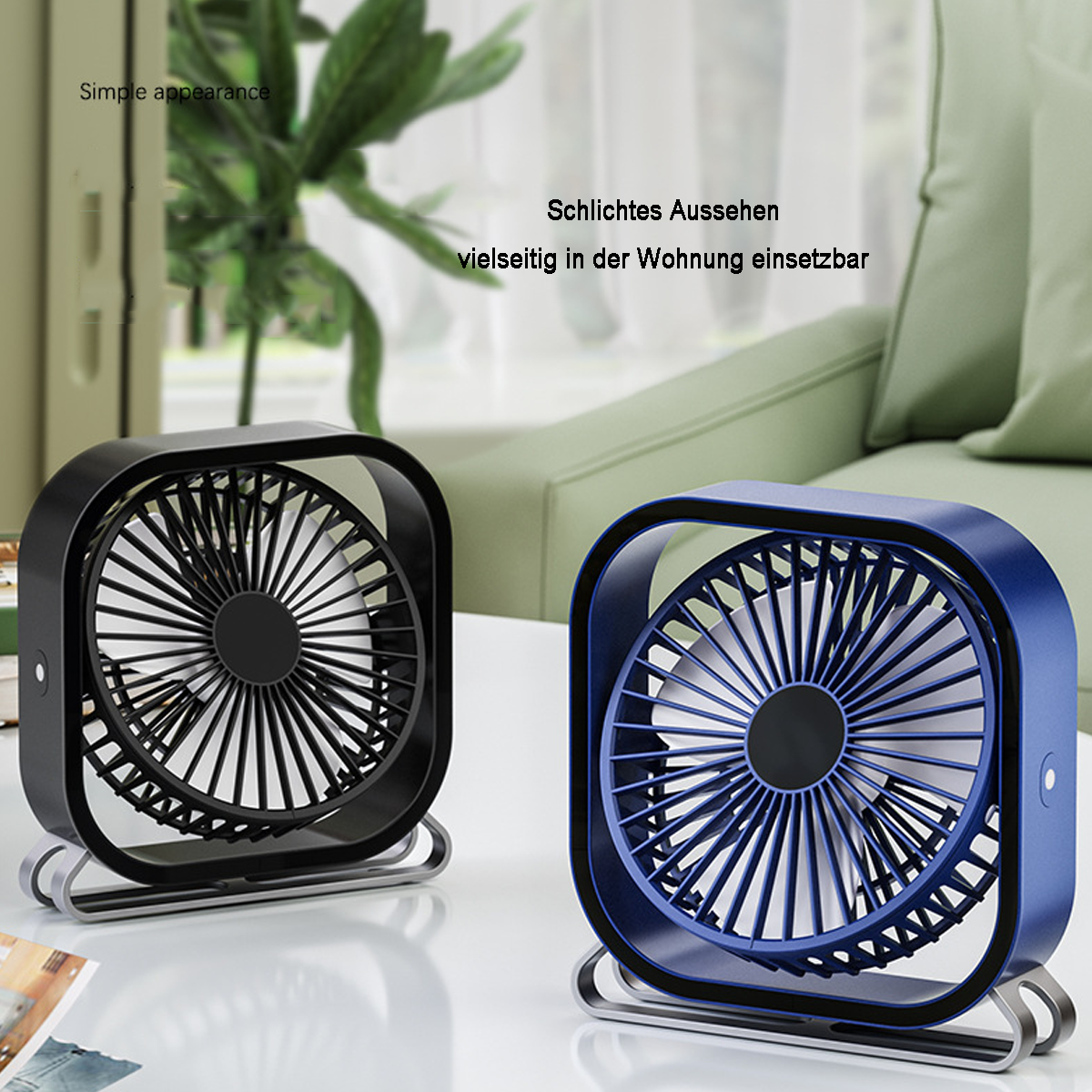 Zwei kleine schwarze und blaue Ventilatoren auf weißer Oberfläche. Einfaches Aussehen.