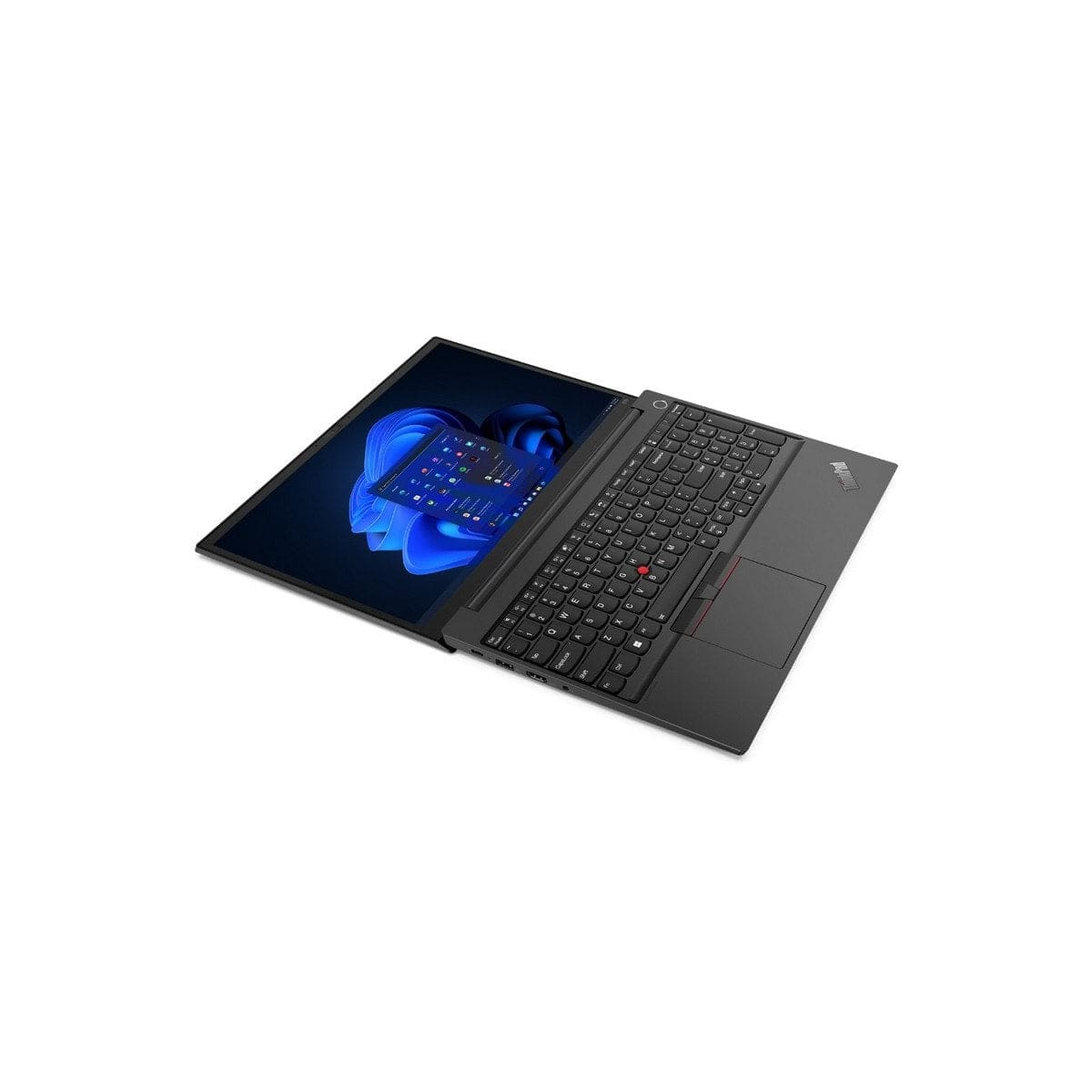 Una computadora portátil negra, abierta, mostrando un fondo de pantalla azul y blanco con el logo de Windows.