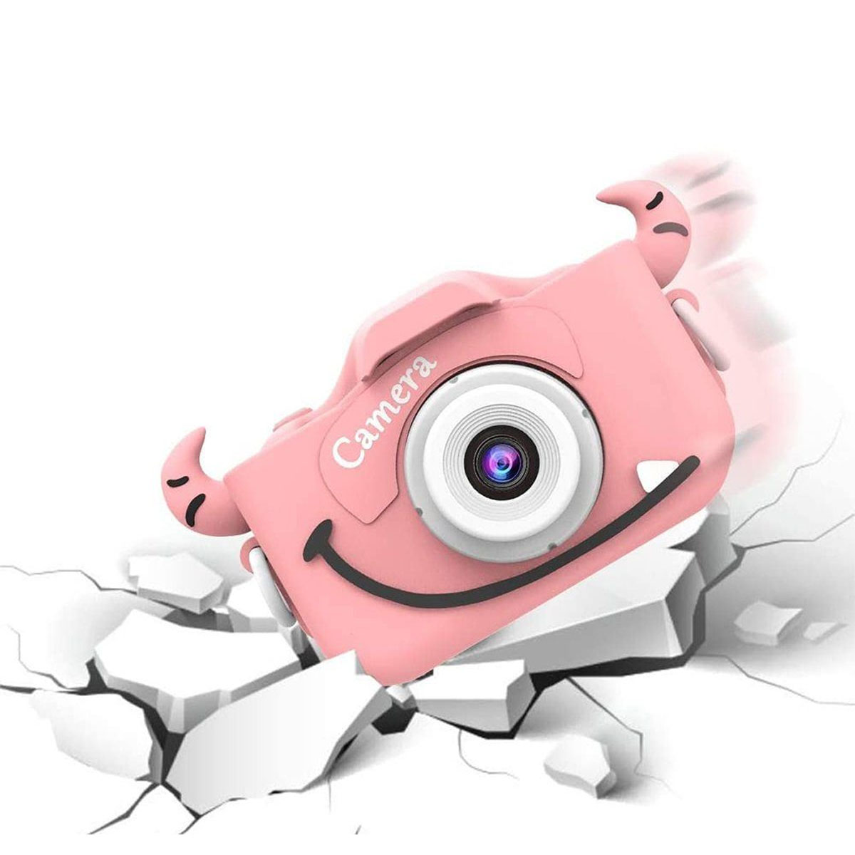Cámara de juguete rosa con diseño de monstruo sobre superficie blanca, suelo agrietado.