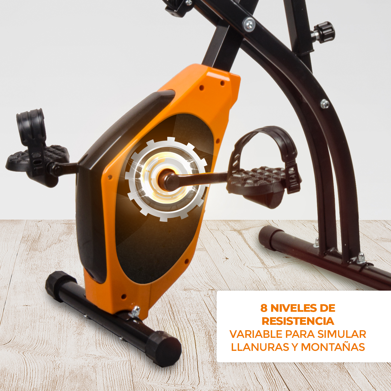 Bicicleta estática naranja y negra con gráfico de engranaje iluminado.