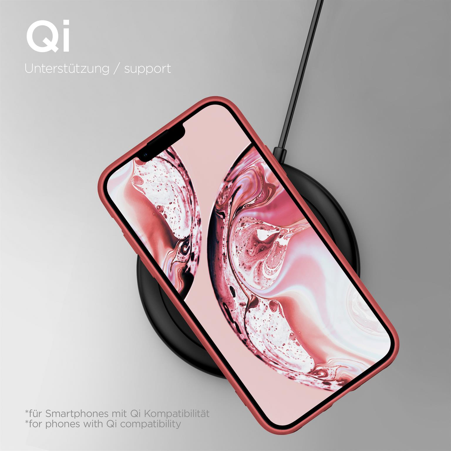 Smartphone auf kabellosem Ladegerät. Telefon in roter Hülle. Schwarzes Ladegerät.
