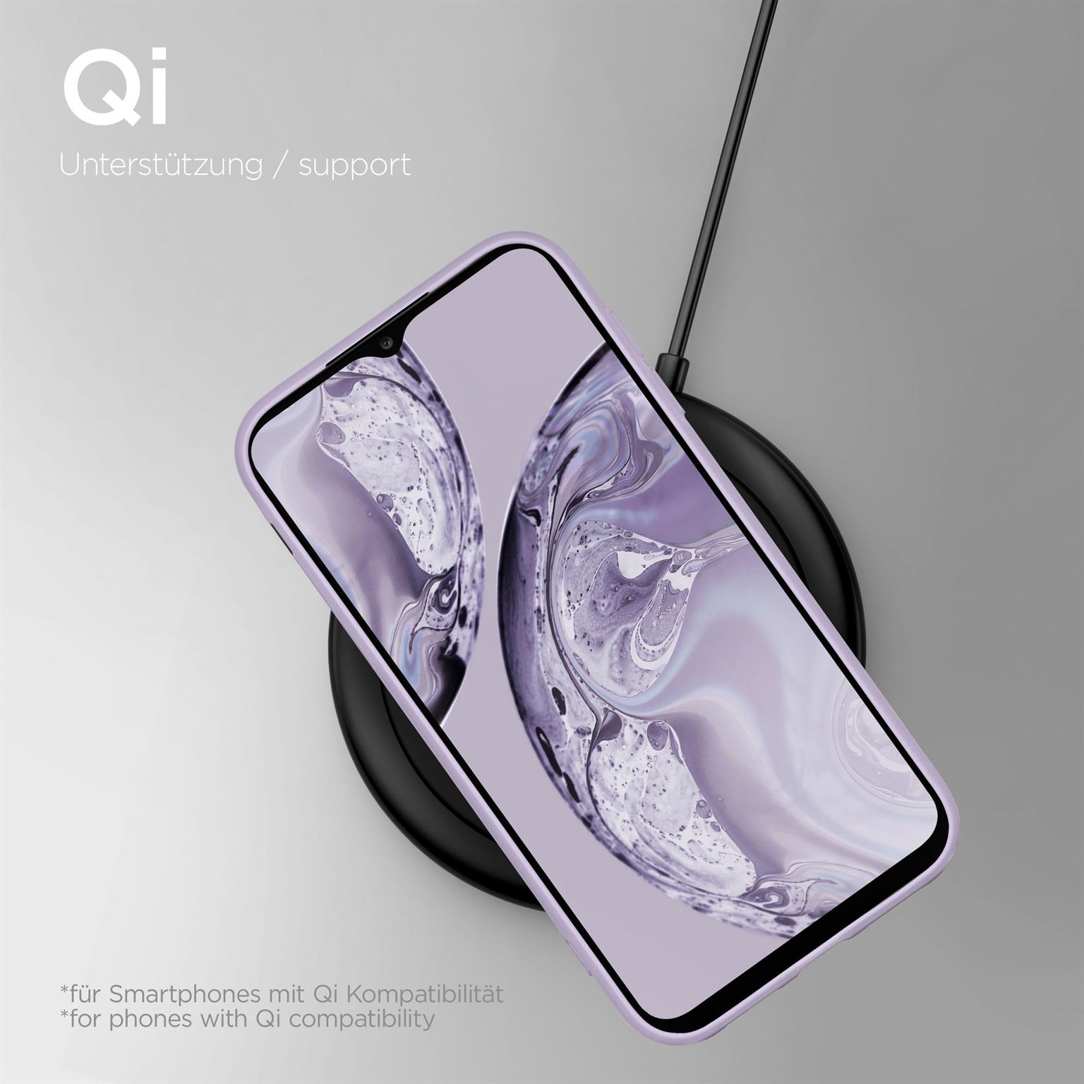 Smartphone auf kabellosem Ladegerät, in einer lila Hülle. Text: Qi-Unterstützung. Heller Hintergrund.