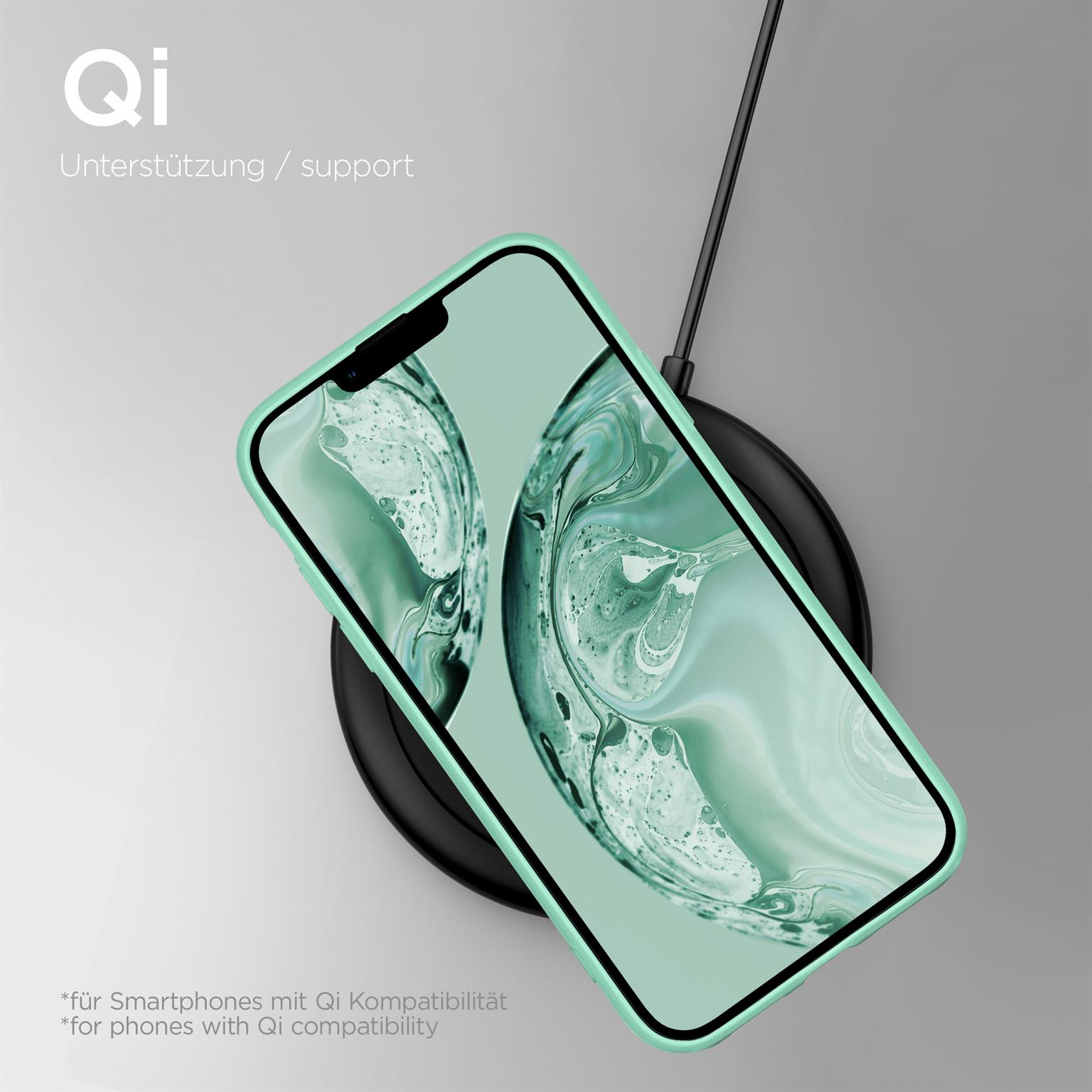 Smartphone auf kabellosem Ladegerät, mit grünem Gehäuse und schwarzem Pad.