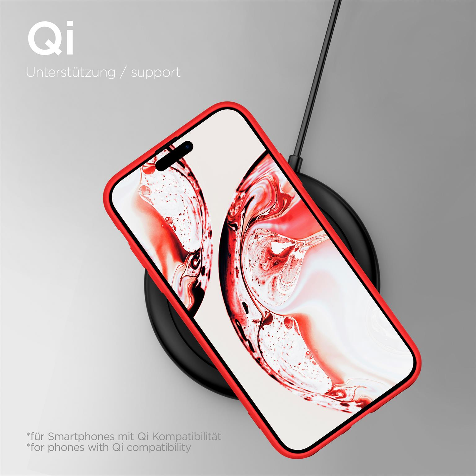 Eine rote Handyhülle auf einem Ladepad. Das Telefon hat ein Blumenbild auf dem Bildschirm.