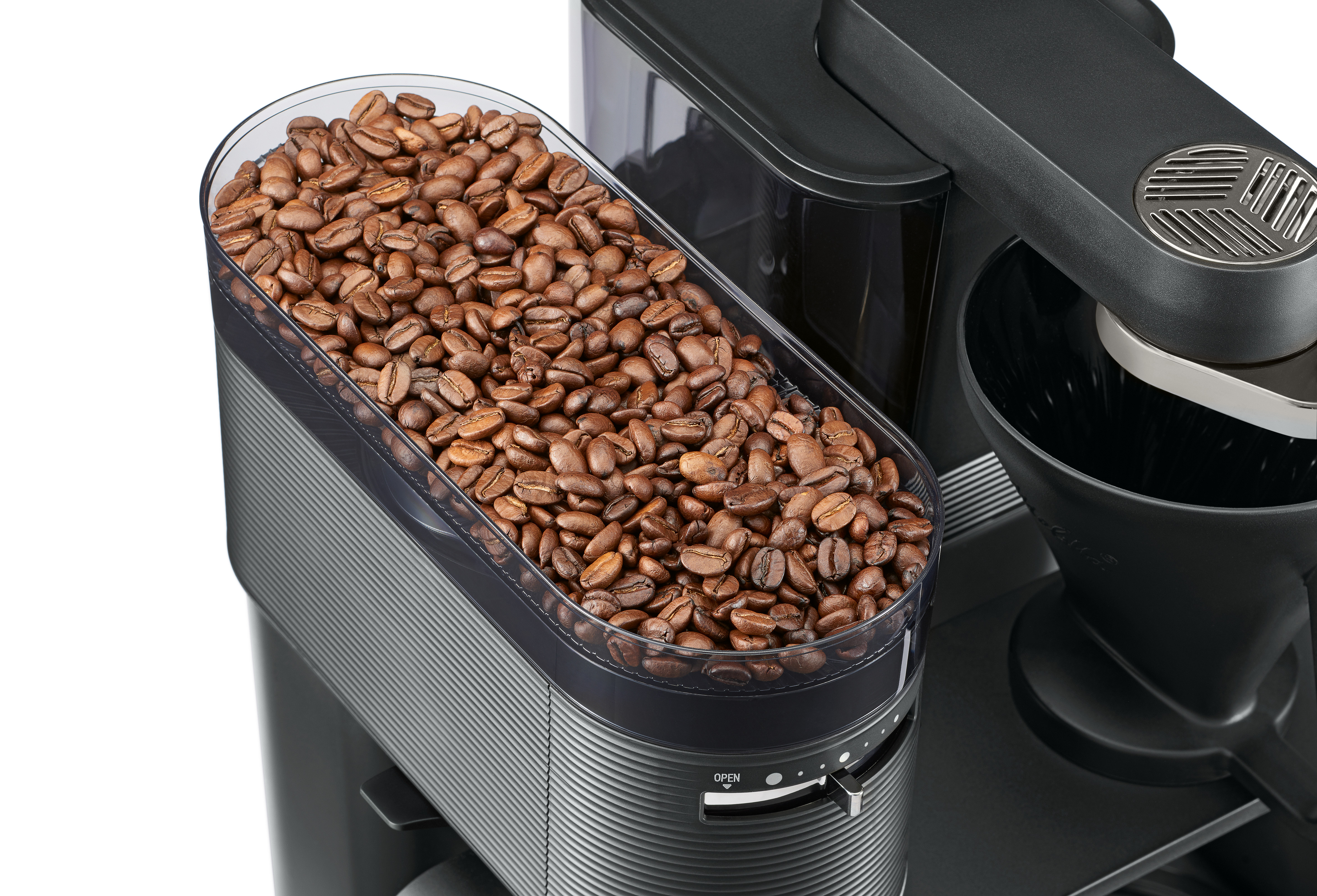 Kaffeebohnenbehälter an einer Kaffeemaschine. Voller Kaffeebohnen. Schwarze Maschine.