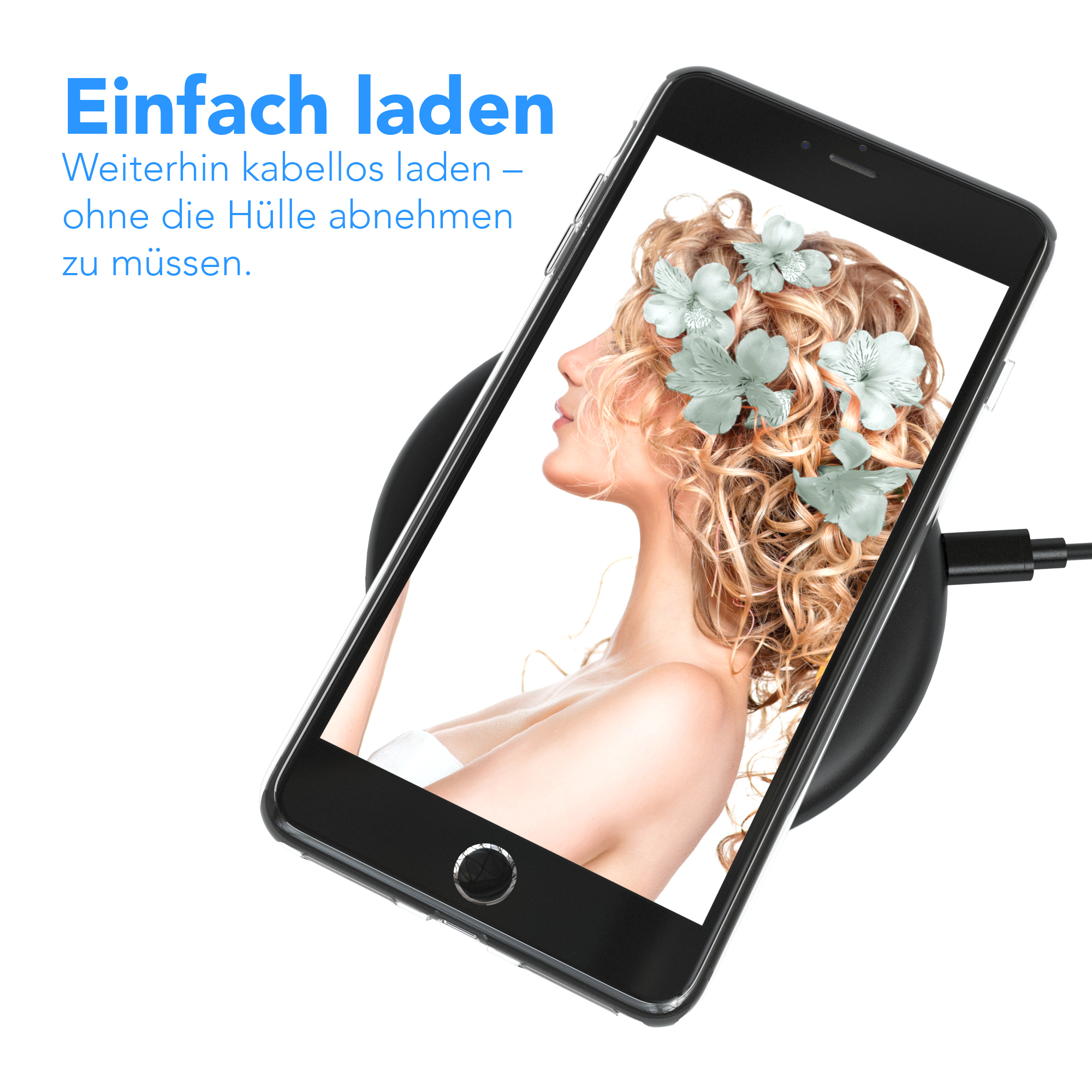 Ein schwarzes Telefon wird kabellos auf einem schwarzen Pad aufgeladen. Ein Frauenporträt mit Blumen auf dem Bildschirm.