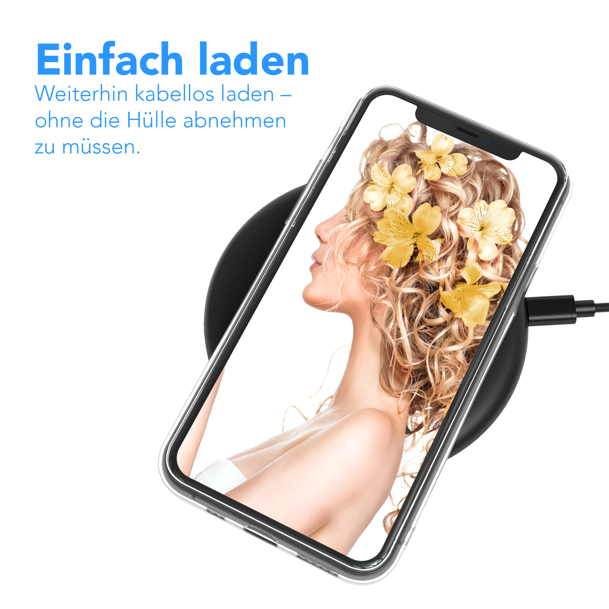 Telefon wird kabellos auf einem schwarzen Pad geladen. Telefon zeigt Frau mit gelben Blumen.