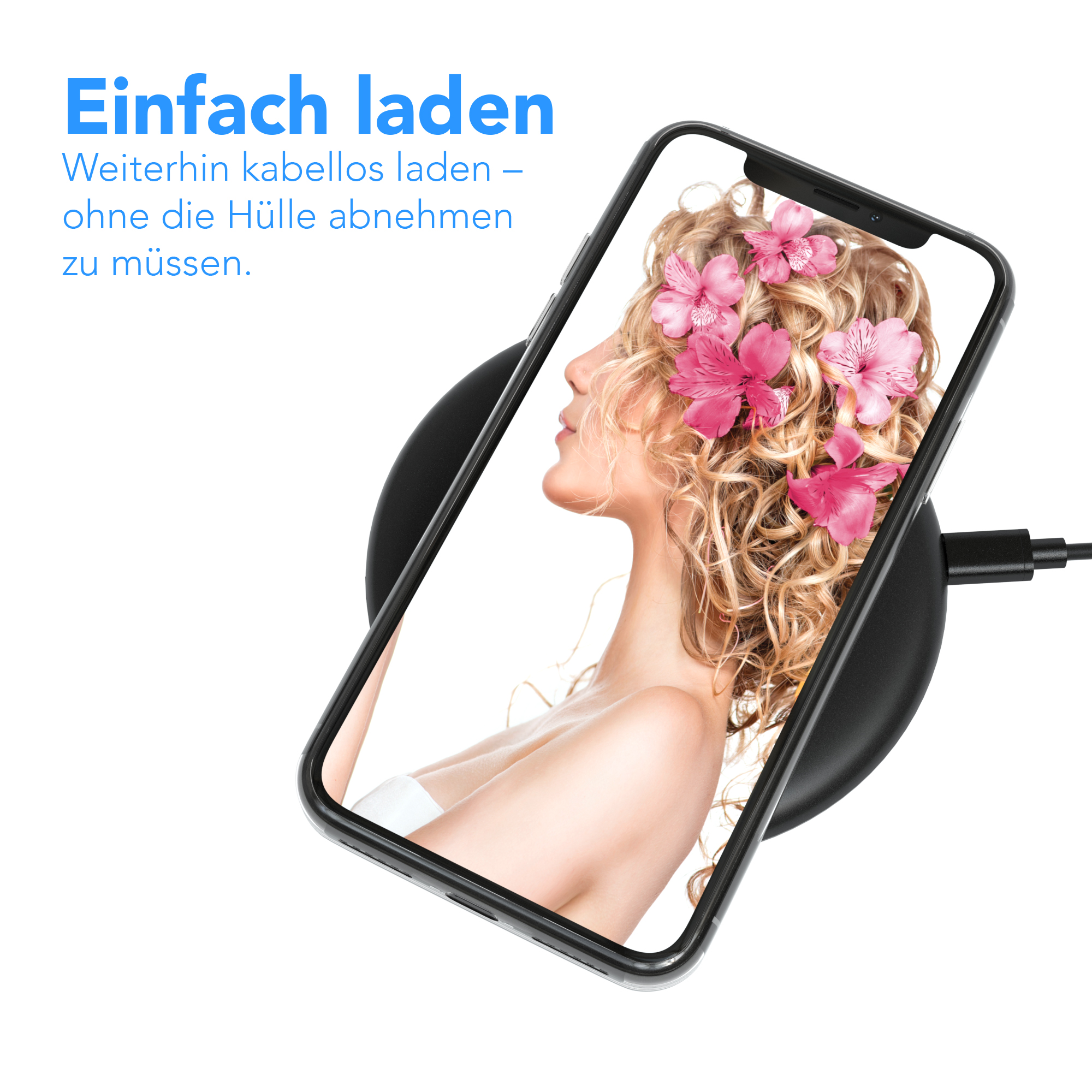 Ein Telefon auf einer kabellosen Ladestation mit einem Frauengesicht mit rosa Blumen auf dem Bildschirm.