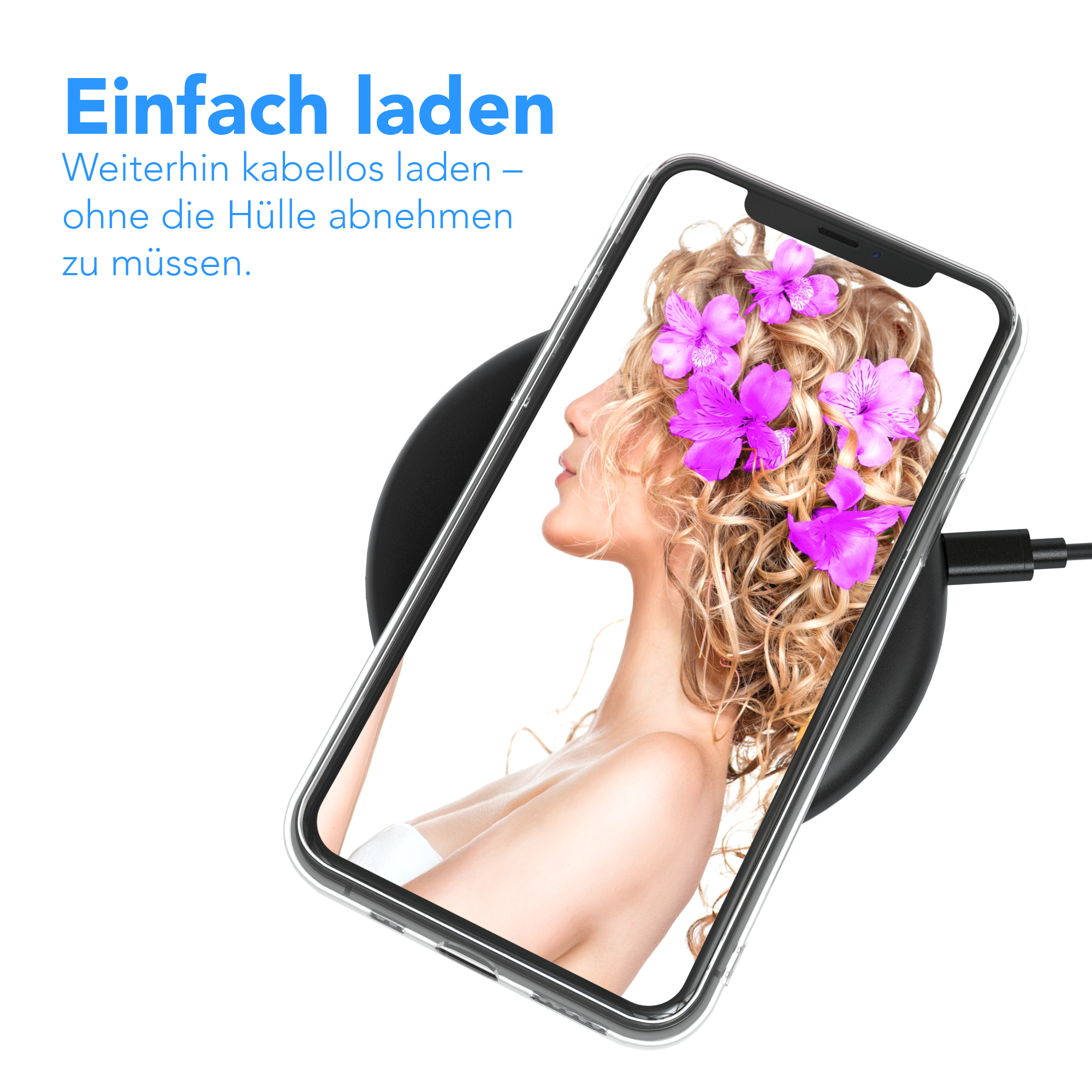 Ein Telefon liegt auf einem schwarzen kabellosen Ladegerät. Das Telefon zeigt das Gesicht einer Frau mit Blumen im Haar.