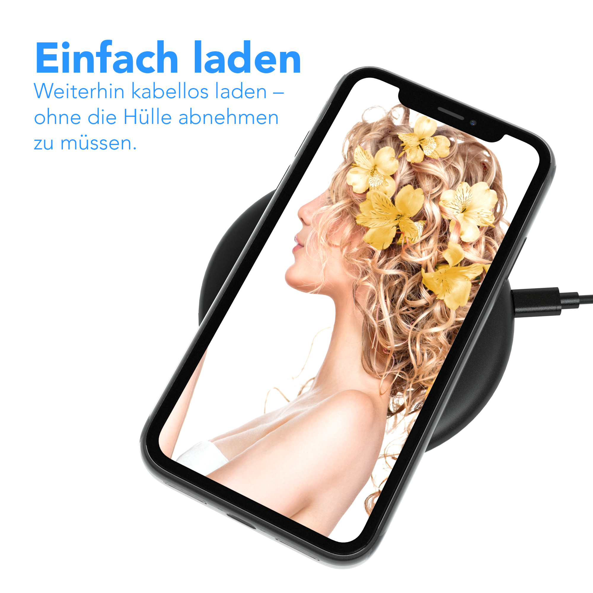 Ein Telefon auf einem kabellosen Ladegerät. Das Telefon zeigt eine Frau mit Blumen im Haar. Schwarzes Ladegerät.