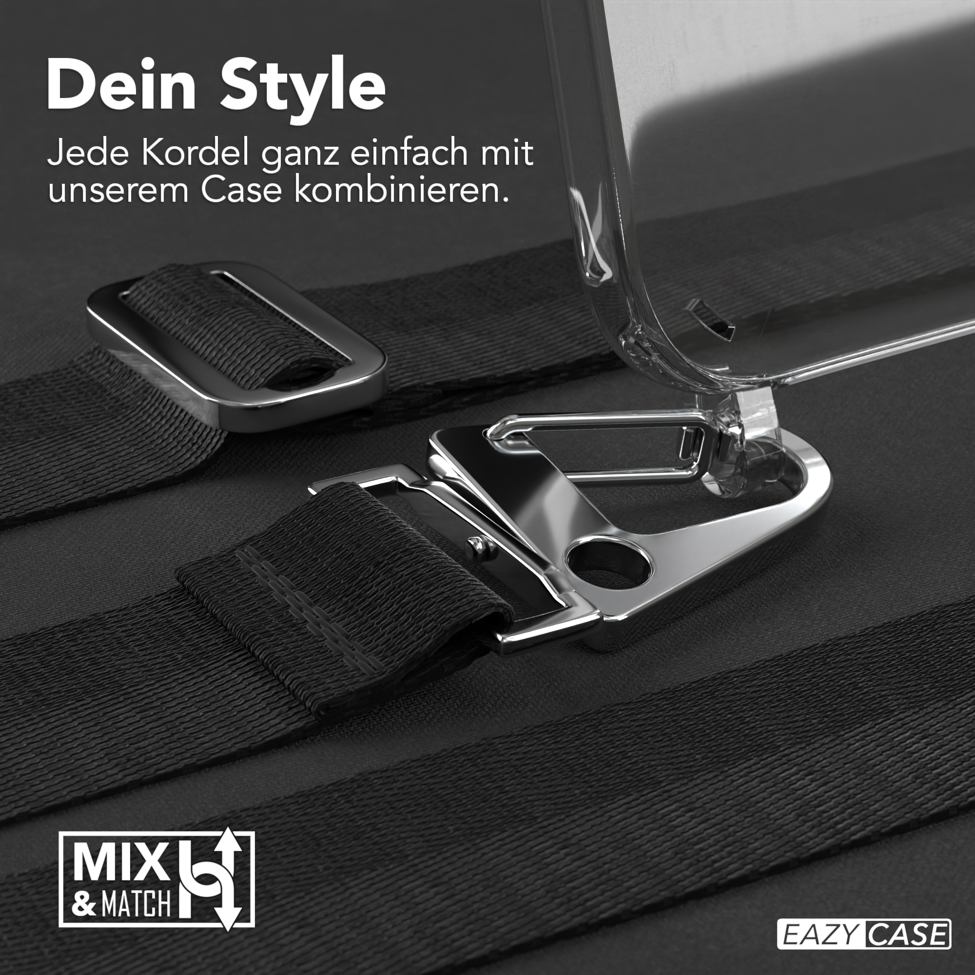 Schwarze Träger und eine silberne Schnalle auf schwarzem Untergrund. Eine klare Handyhülle oben rechts.