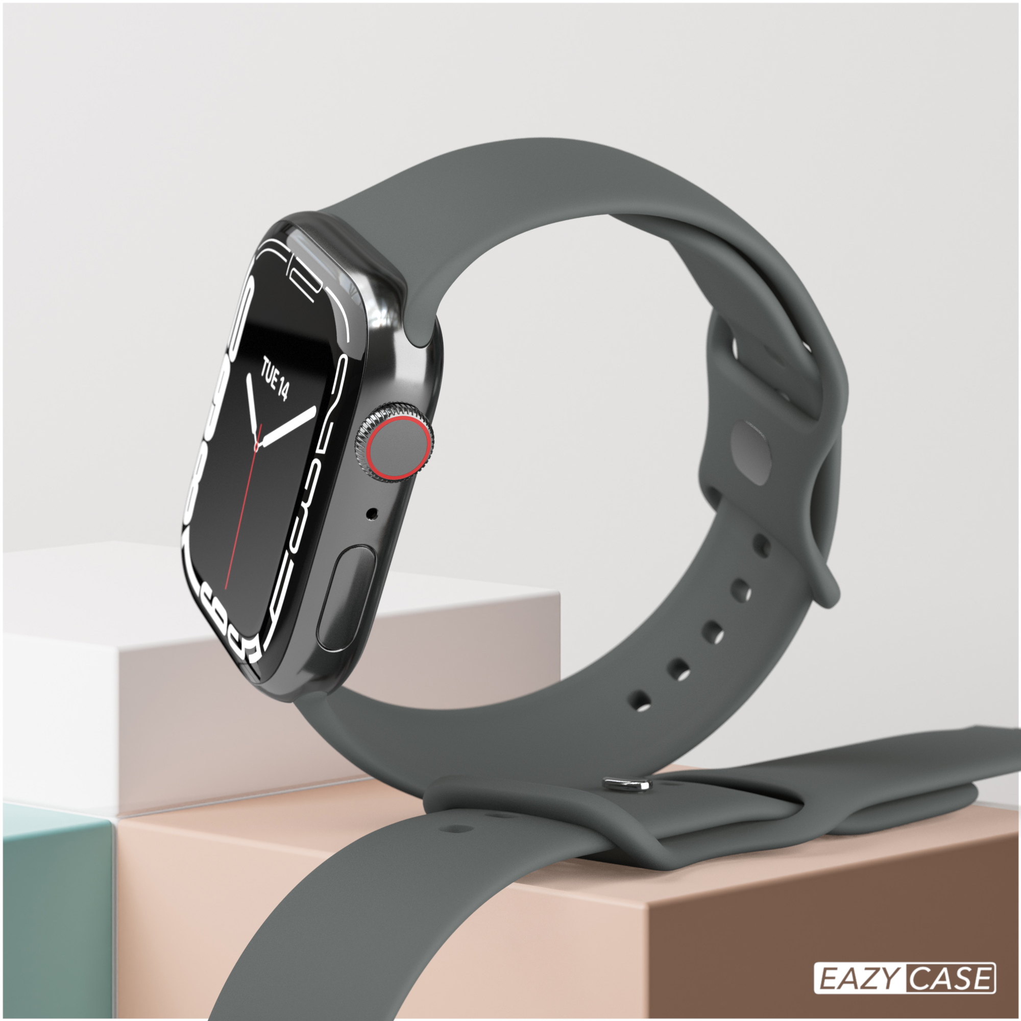 Eine graue Apple Watch auf einem Ständer. Die Uhr zeigt die Uhrzeit an und hat ein graues Armband.