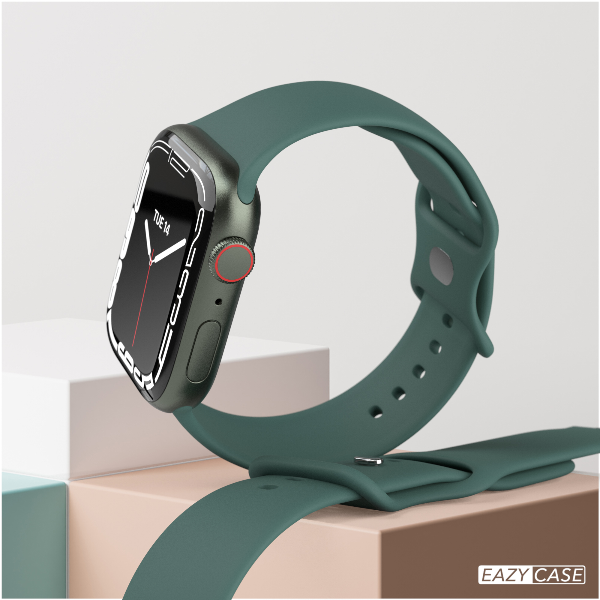 Smartwatch mit grünem Armband und dunkelgrünem Gehäuse. Uhr zeigt Datum, Di 14. Weißer und rosa Hintergrund.