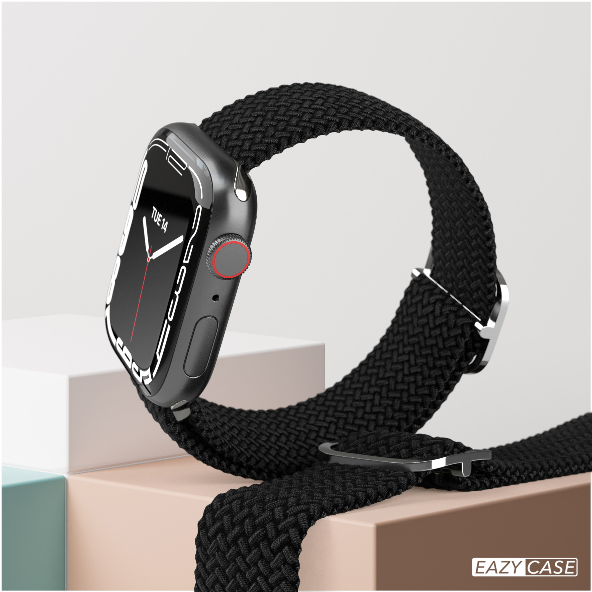 Schwarze Apple Watch mit schwarzem geflochtenem Armband, auf beiger Oberfläche.