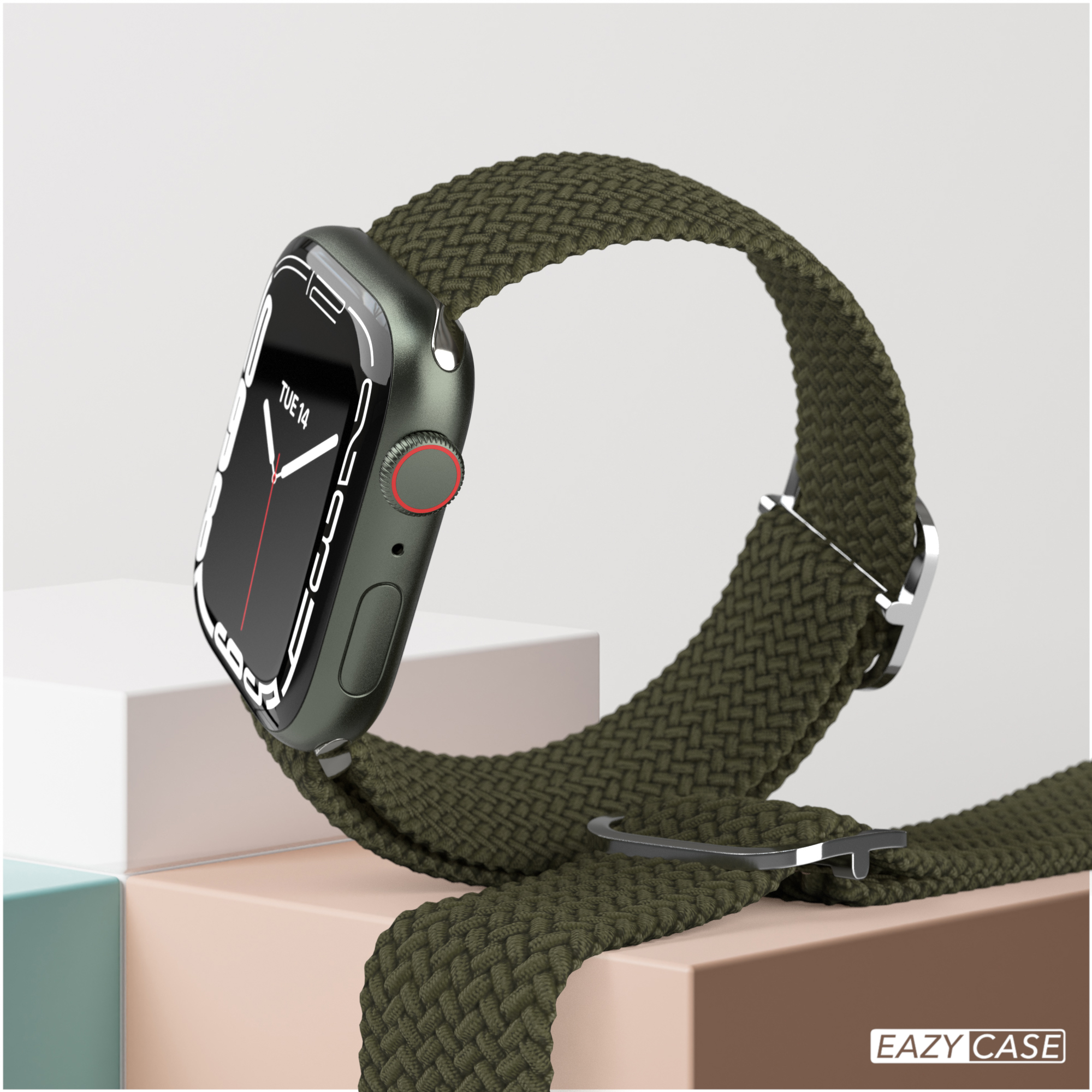 Apple Watch mit grünem gewebten Armband auf weißer Oberfläche, mit weißem Hintergrund.