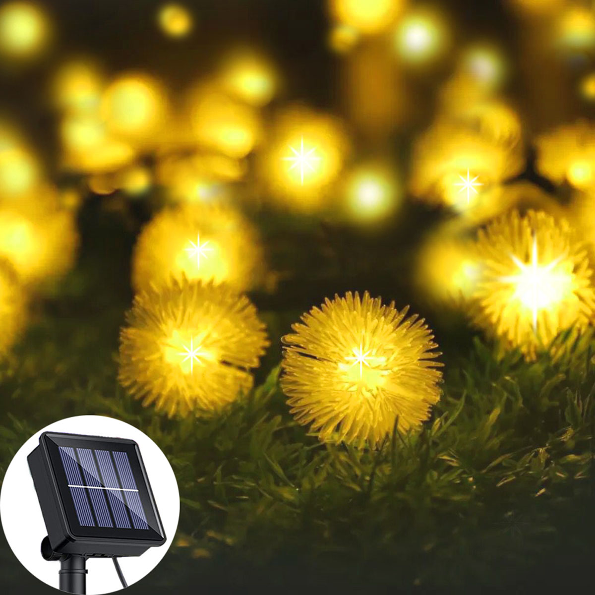 Solarbetriebene Lichterkette mit gelben Lichtern, auf grünem Gras. Kleines Solarpanel links.