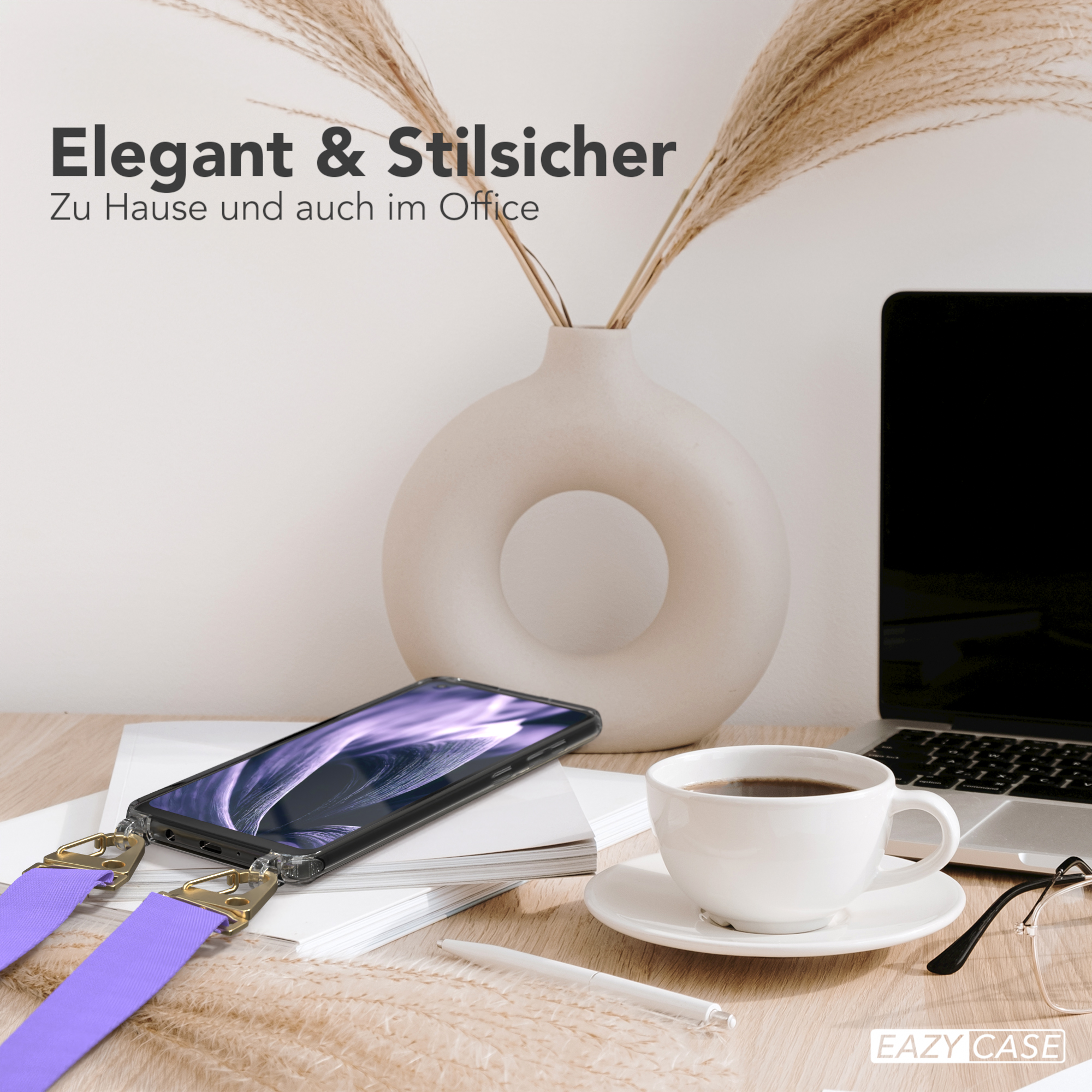 Telefon auf dem Schreibtisch mit Kaffee, Vase und Laptop in Büroumgebung.