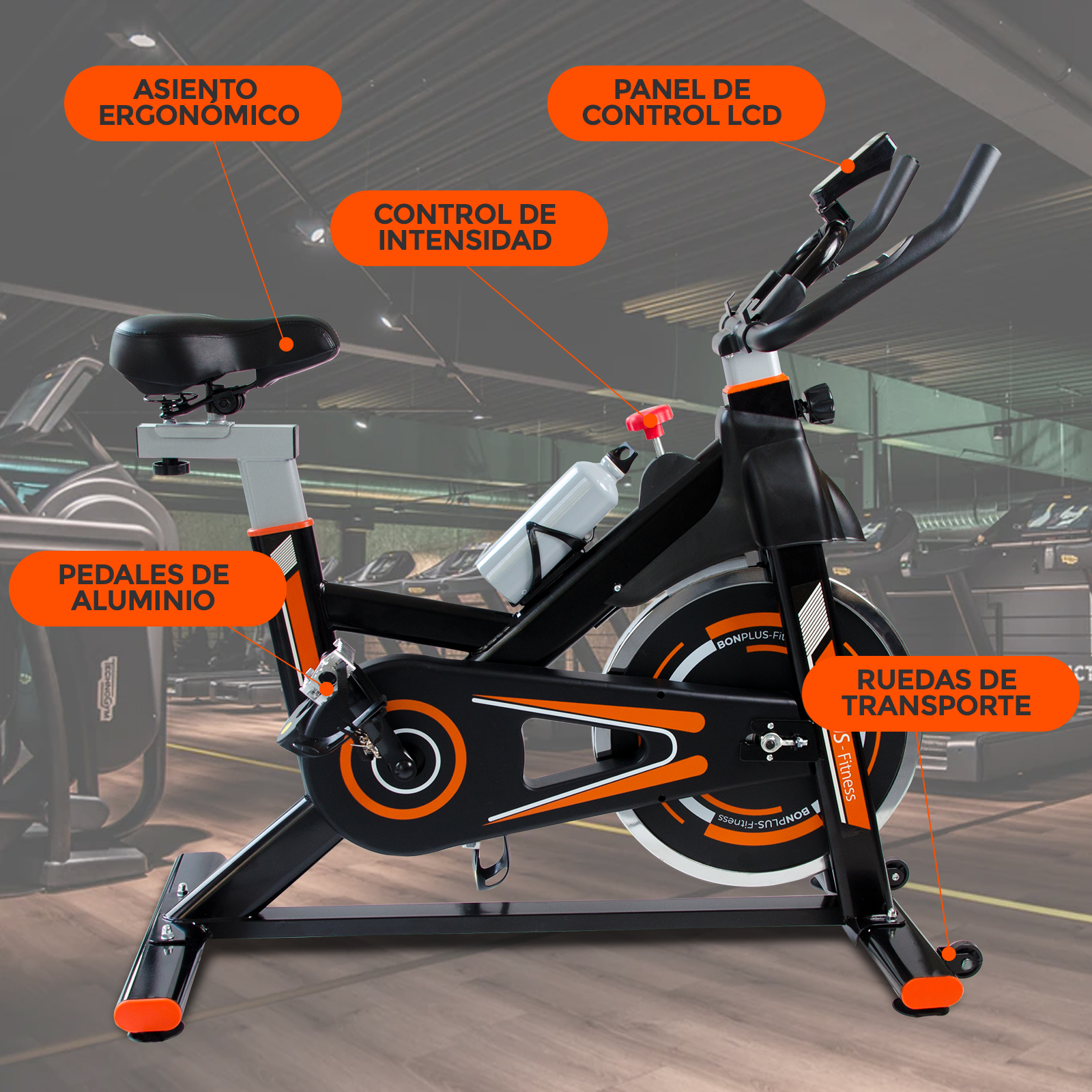 Bicicleta estática. Características: asiento ergonómico, panel LCD y detalles naranjas.