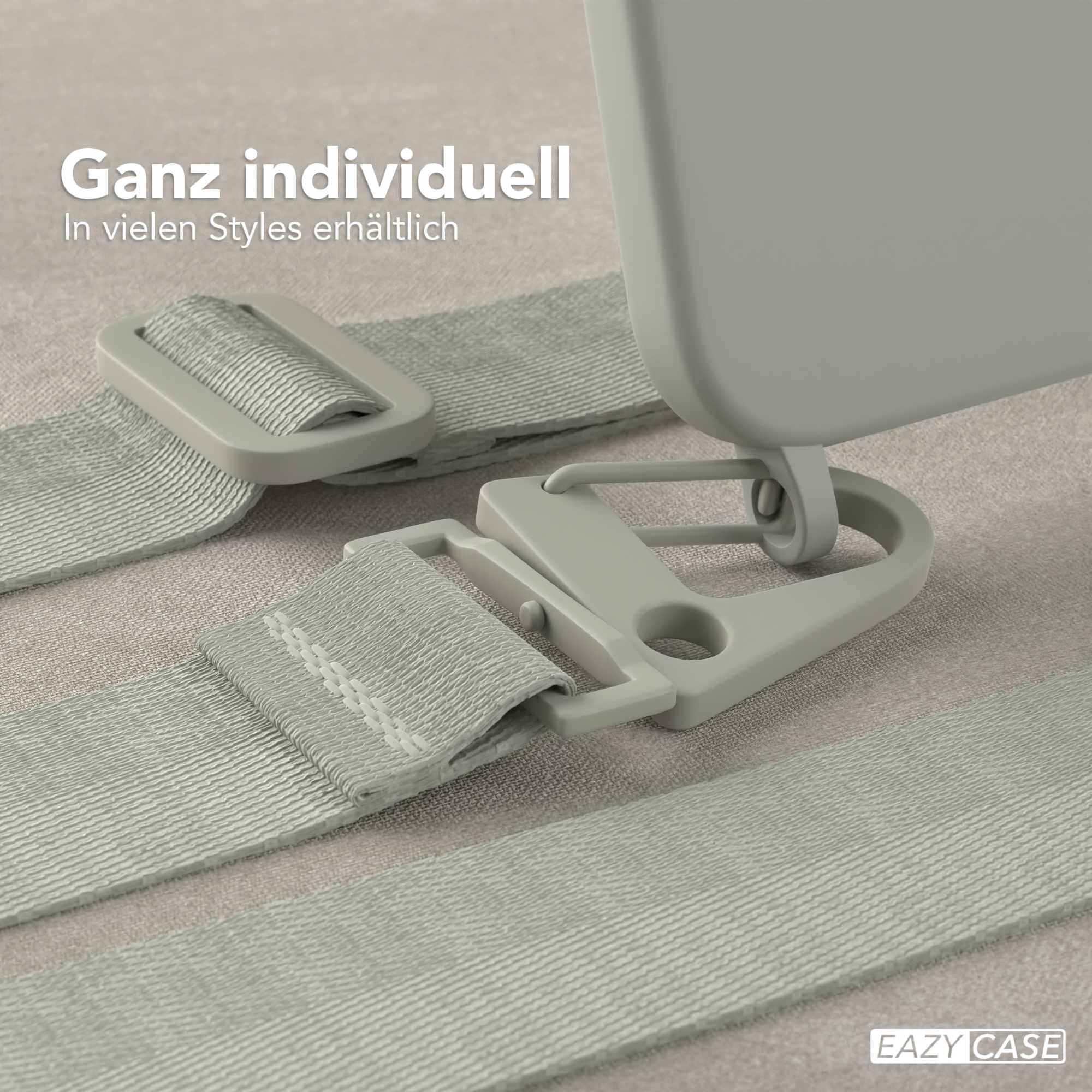 Nahaufnahme grauer Gurte und Clips, die an einem hellgrauen Gehäuse befestigt sind.