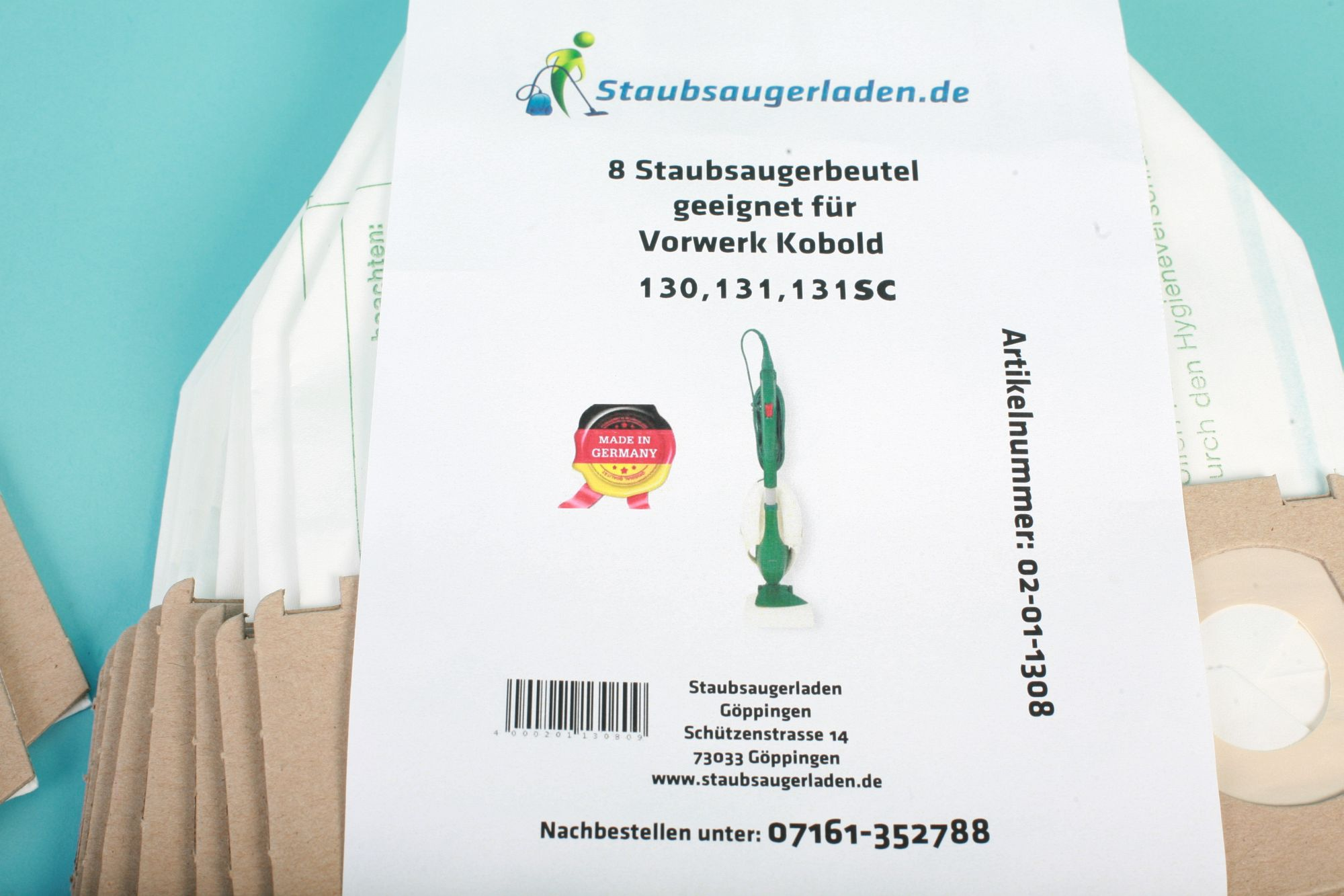 Eine Packung Staubsaugerbeutel. Die Beutel sind weiß und braun.