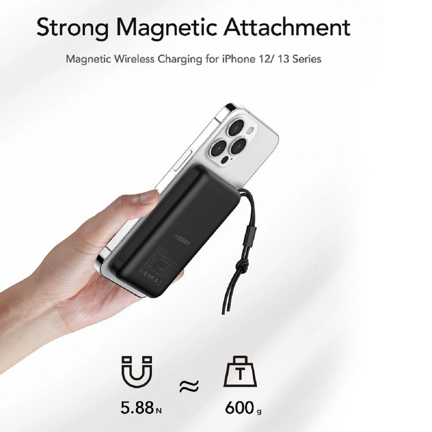 Schwarze Powerbank lädt ein weißes Telefon. Text über magnetisches Laden.