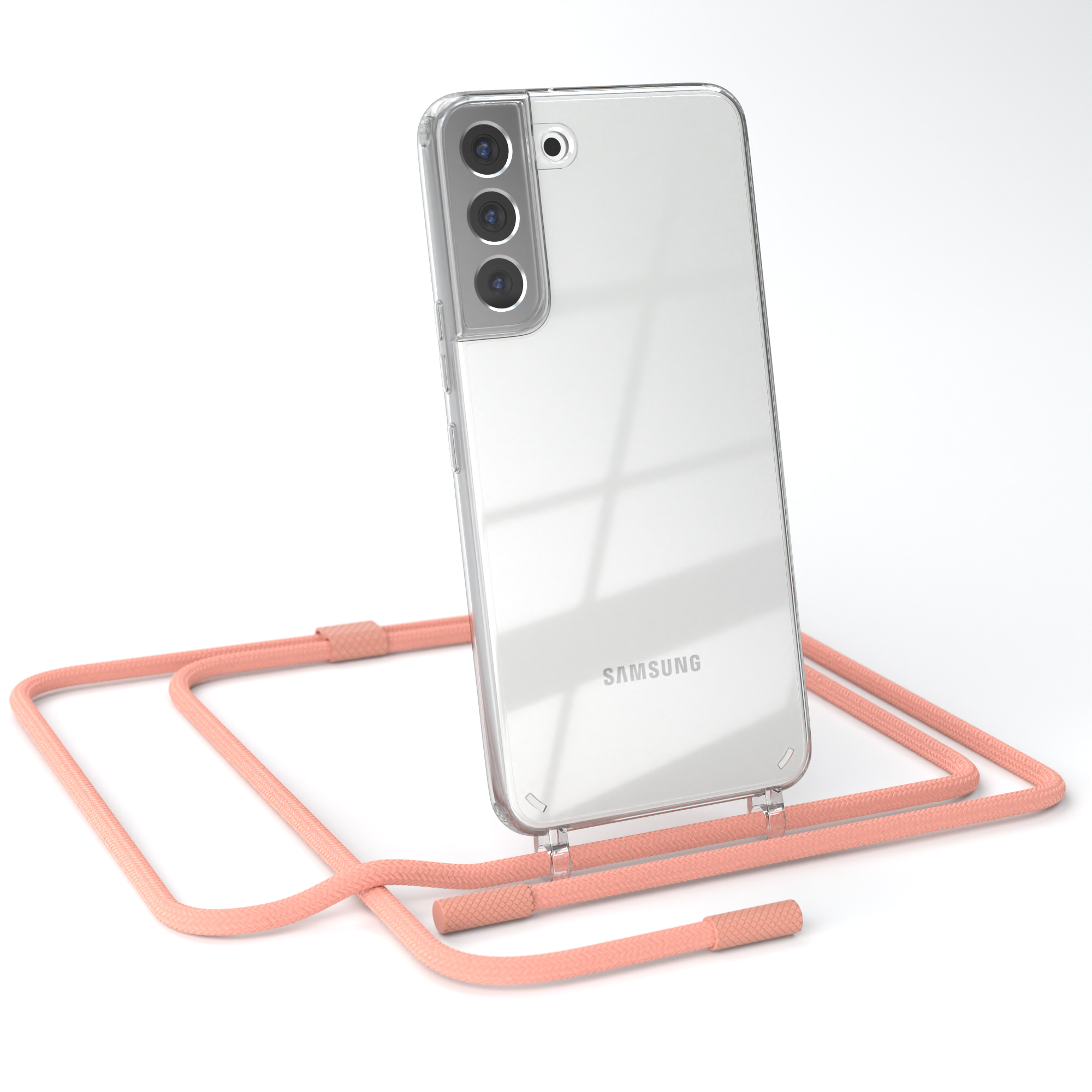 Transparente Handyhülle mit pfirsichfarbenem Riemen. Samsung-Telefon sichtbar. Weißer Hintergrund.