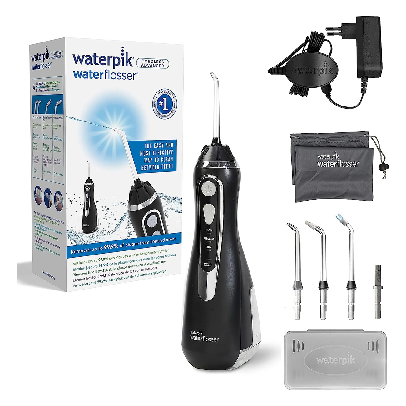 Ensemble hydropulseur Waterpik, avec accessoires, boîte et adaptateur secteur.