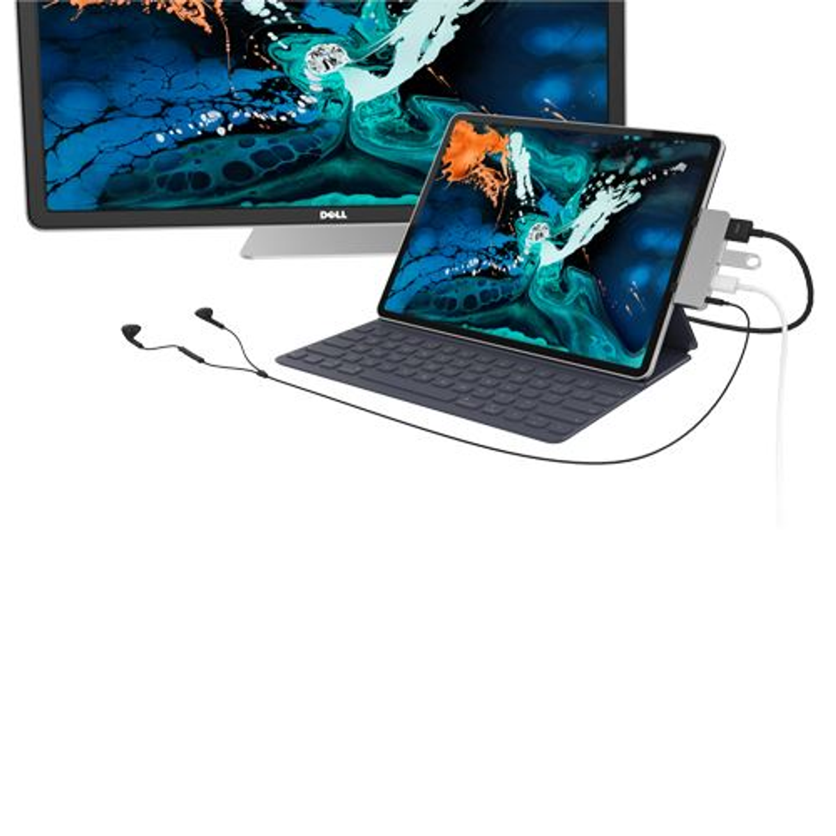 Una tableta conectada a un monitor, teclado y otros dispositivos.