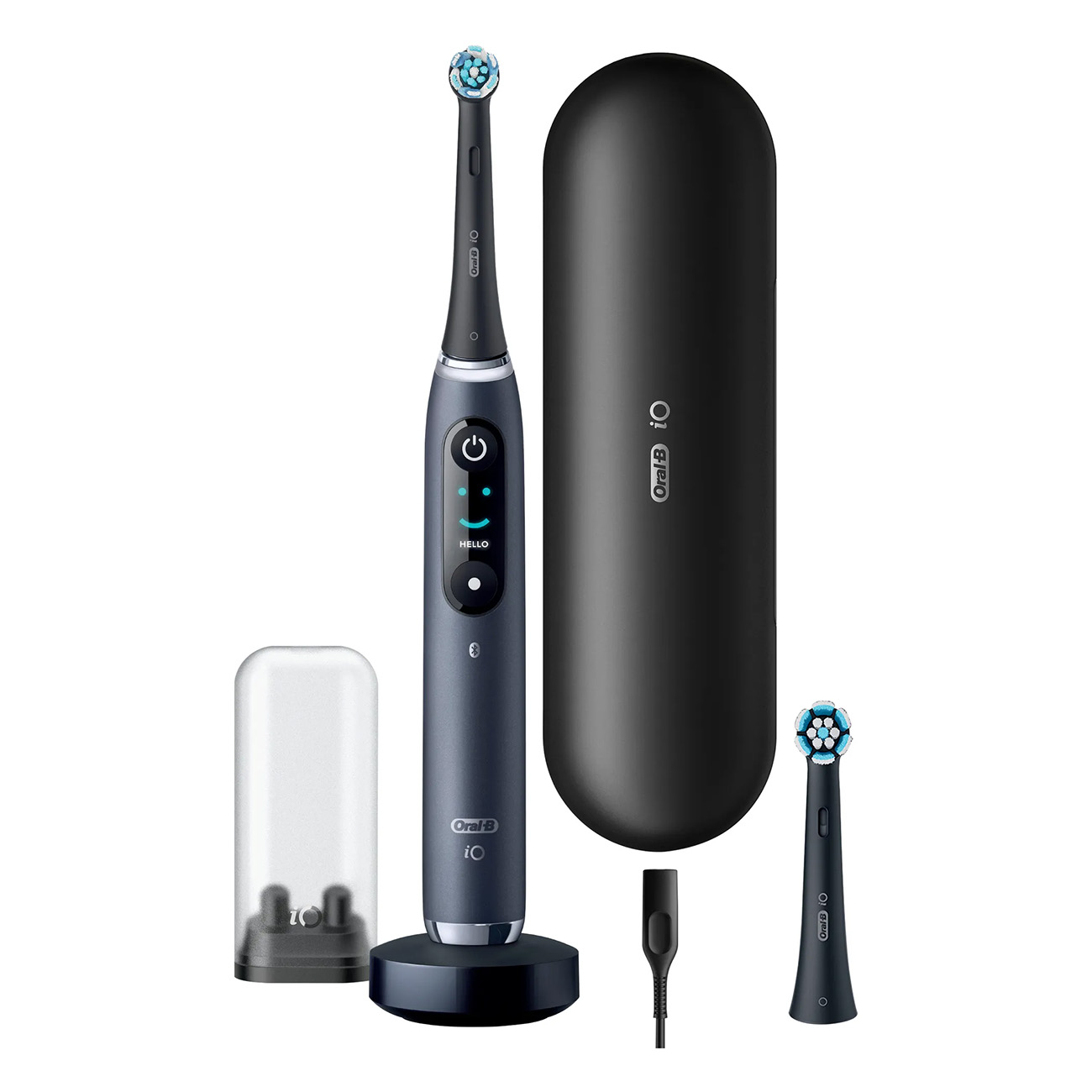 Elektryczna szczoteczka do zębów z ładowarką, etui podróżnym i dodatkową główką.