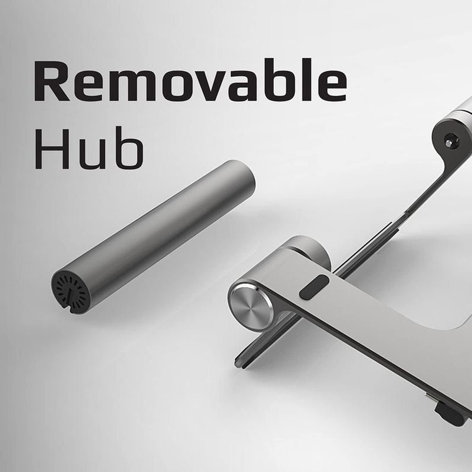 Supporto per laptop argentato con hub argentato rimovibile. È uno sfondo bianco.