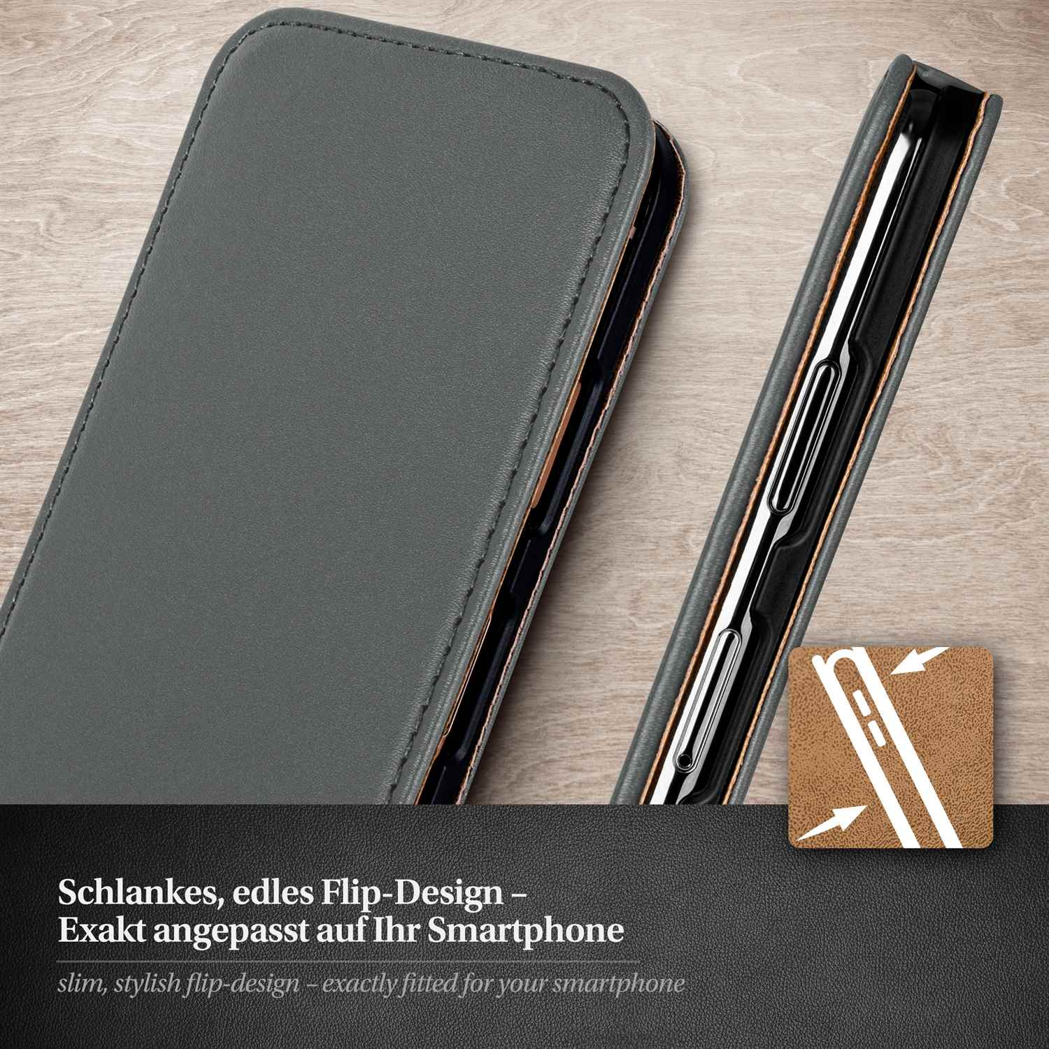 Graue Handyhülle, geöffnet, um das Telefon freizulegen. Holzoberfläche. Text: Stilvolles Flip-Design.