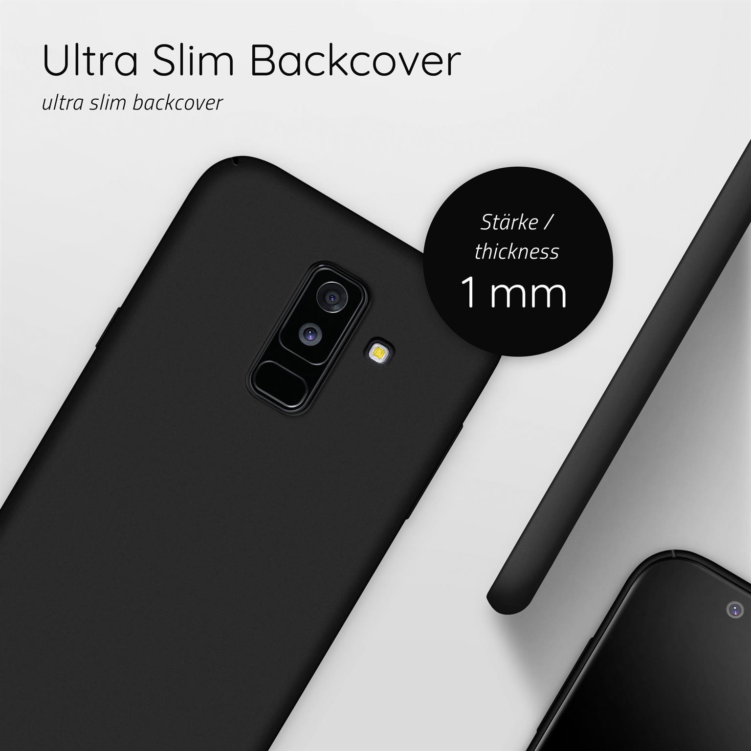 Nahaufnahme eines schwarzen Telefons mit Kameralinse, Rückseite. Eine Hülle ist unten rechts.