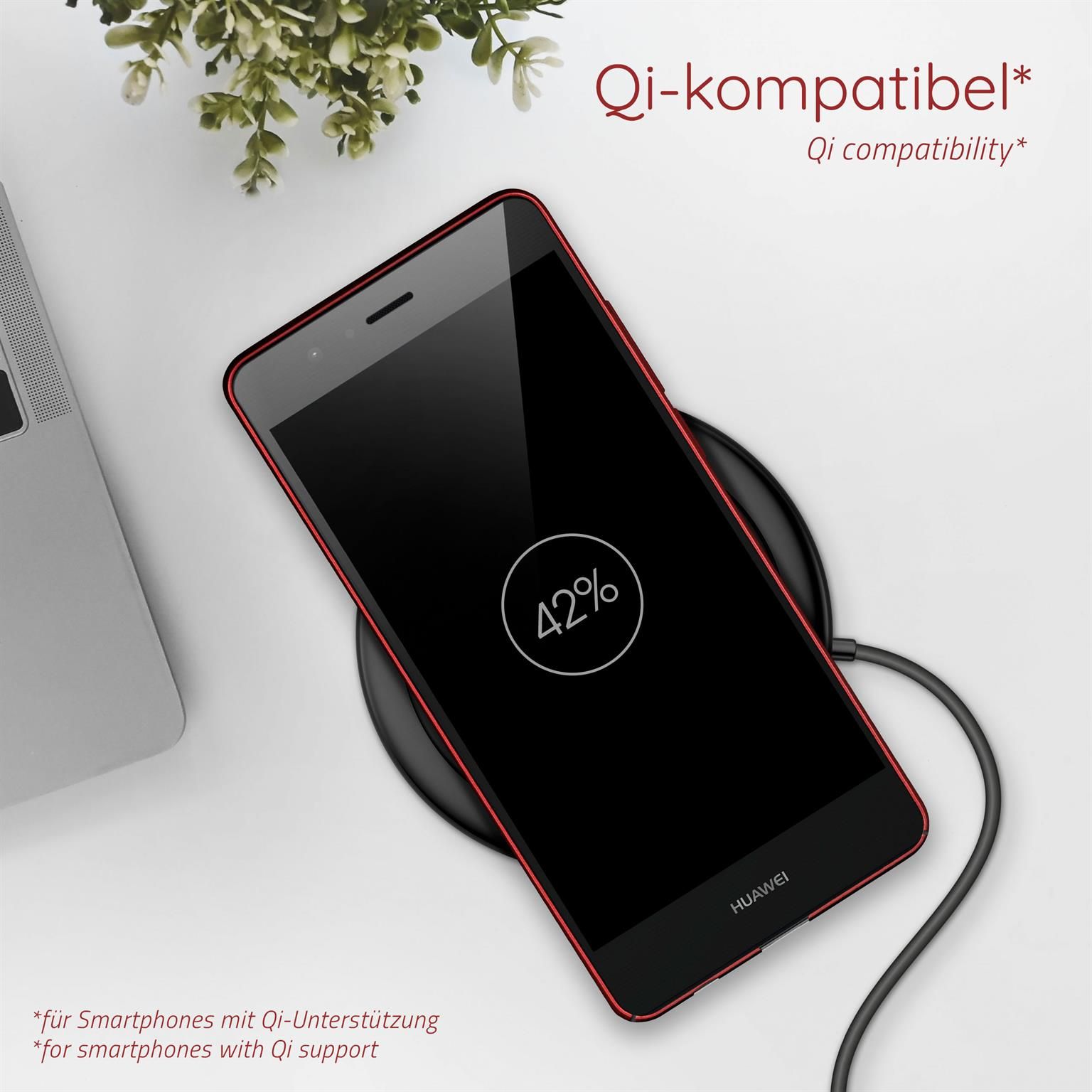 Schwarzes Telefon auf kabellosem Ladegerät. Telefon zeigt 42%. Schwarzes Ladegerät und Telefon. Text: Qi-kompatibel.