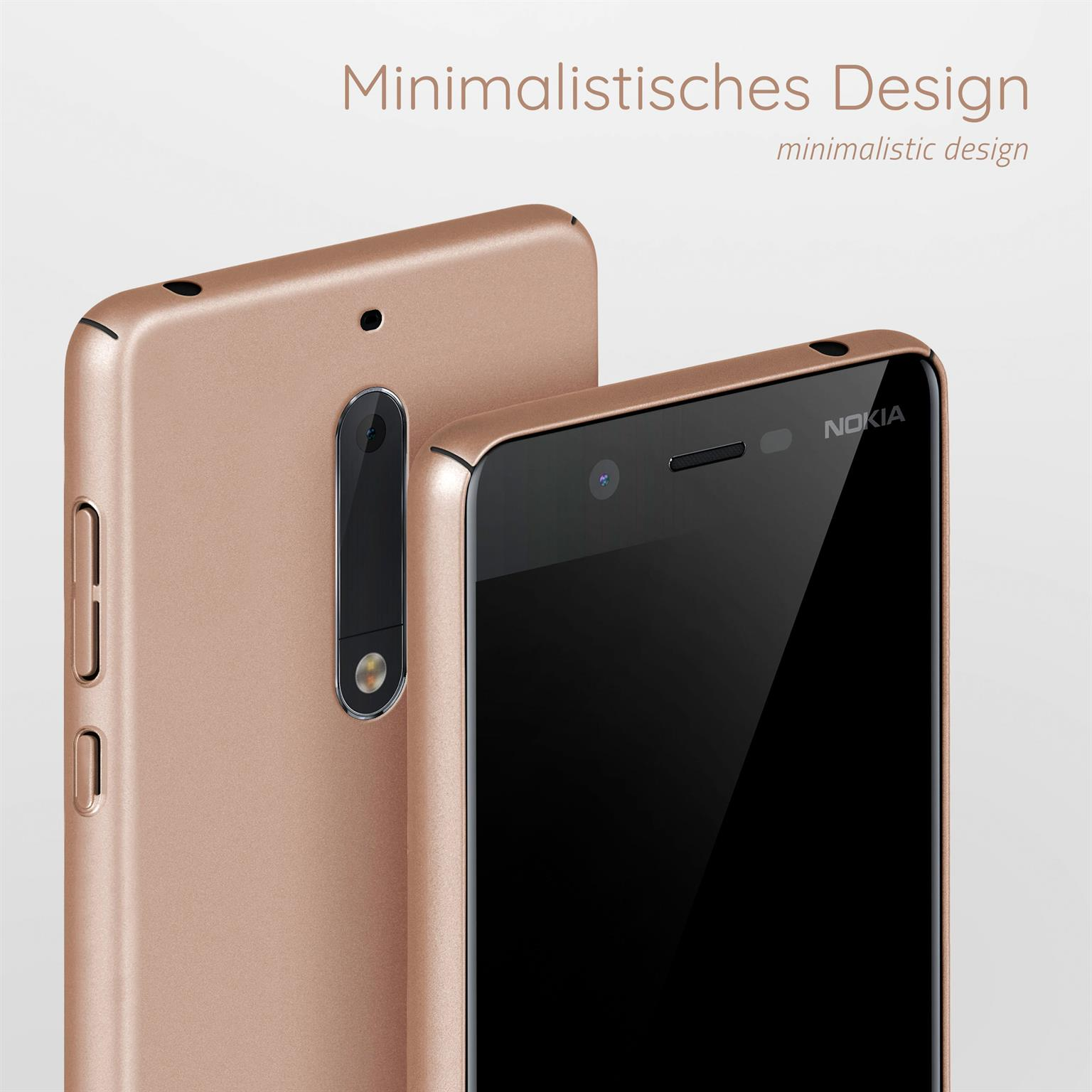 Zwei roségoldene Telefone auf weißem Untergrund. Eines ist fokussiert, das andere leicht dahinter.