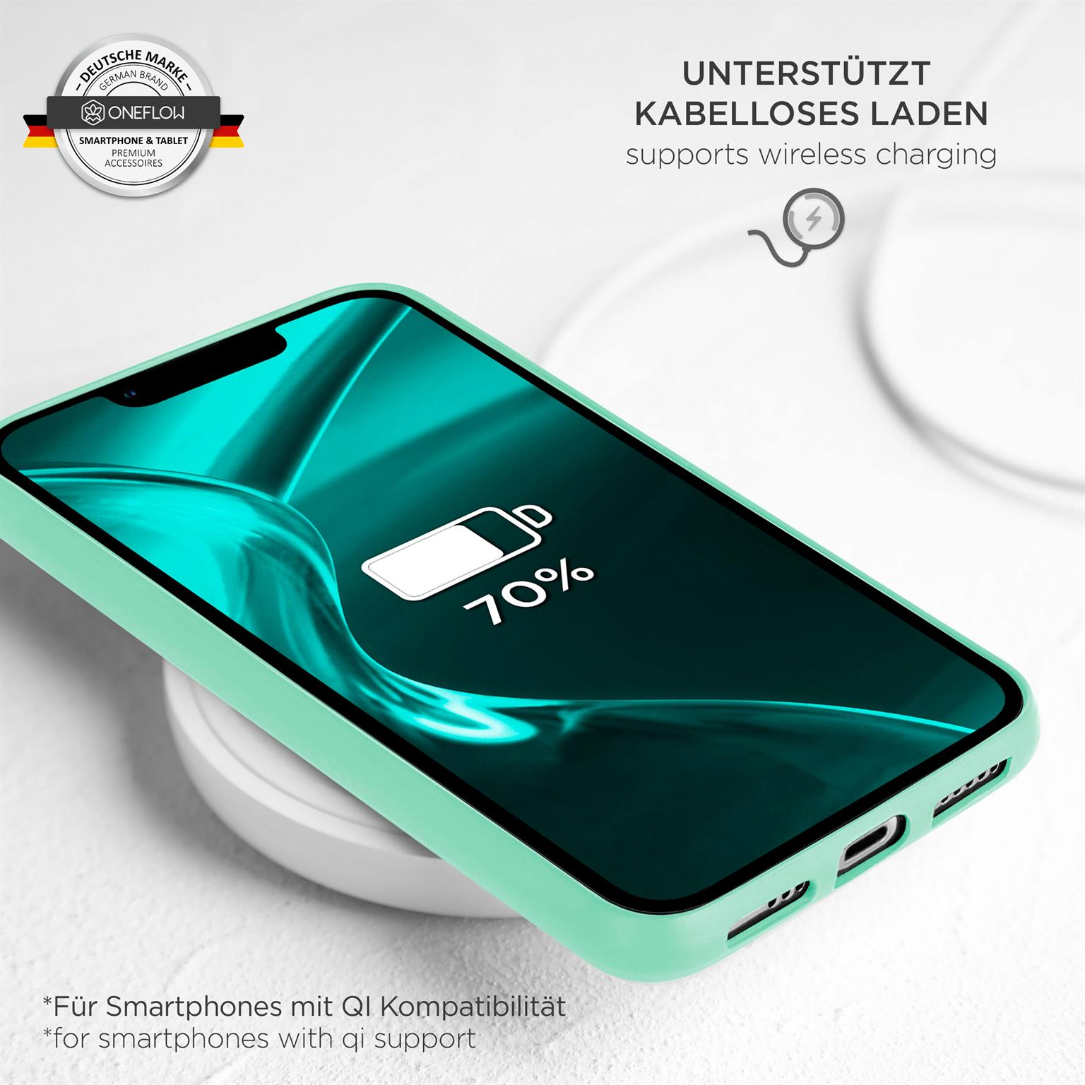 Grünes Telefon auf kabellosem Ladegerät, zeigt 70% Akku. Weißes Ladegerät und grünes Gehäuse.
