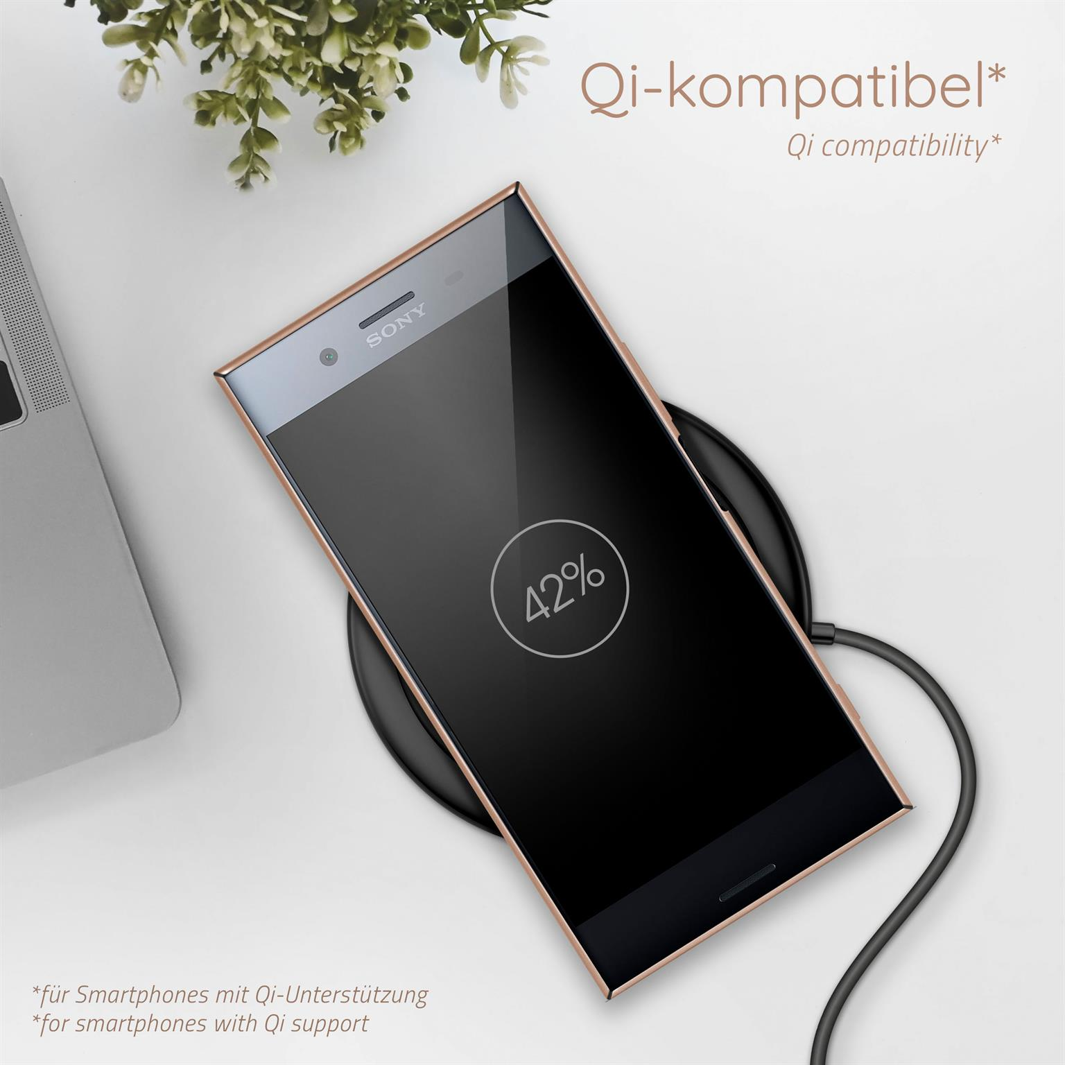 Schwarzes Telefon auf Ladepad, 42% geladen, Text auf Deutsch.
