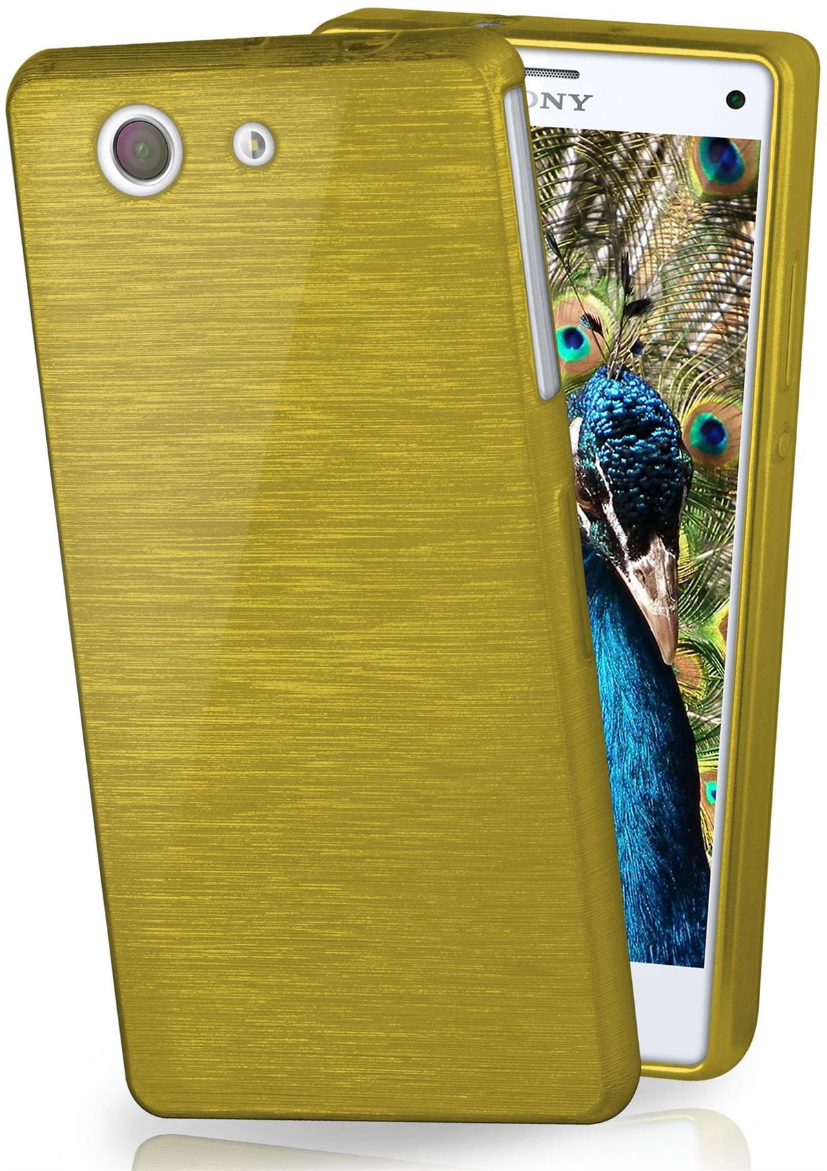Goldene Handyhülle. Die Handyhülle ist goldfarben mit Metallic-Finish. Ein Pfau ist im Bild des Telefons.