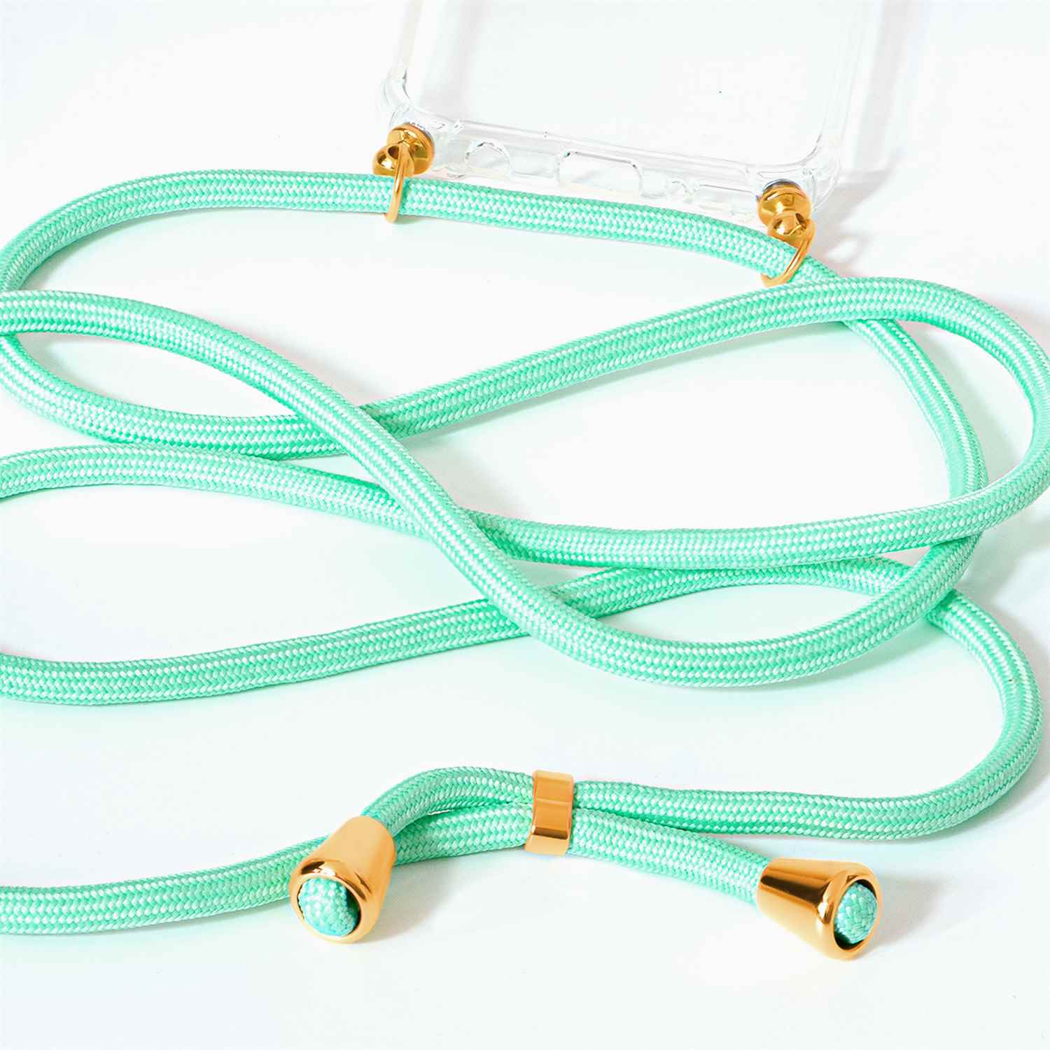 Nahaufnahme eines mintgrünen Telefonriemens mit goldenen Metallenden.