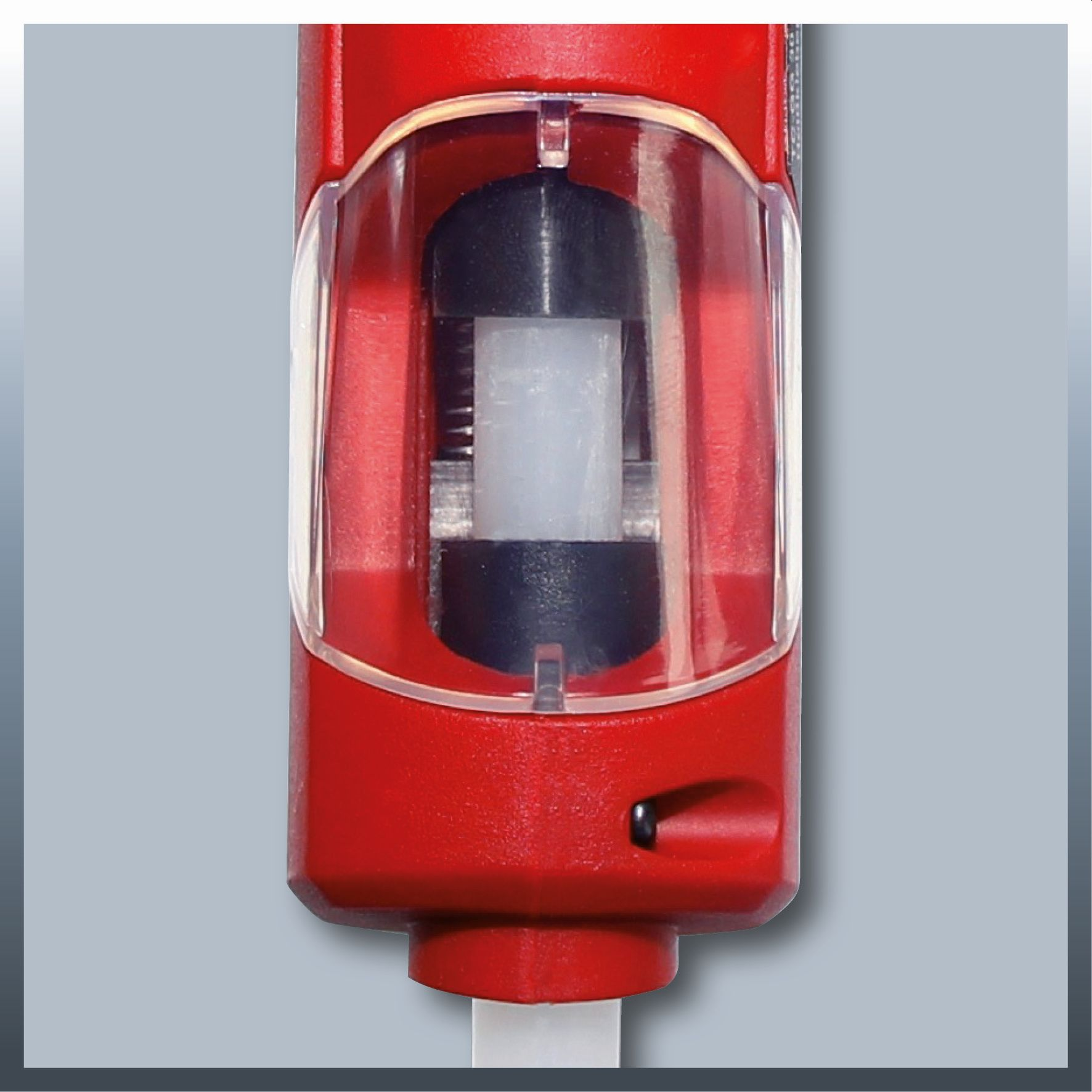 Widok z bliska czerwonego włącznika elektronarzędzia z przezroczystą osłoną ochronną.