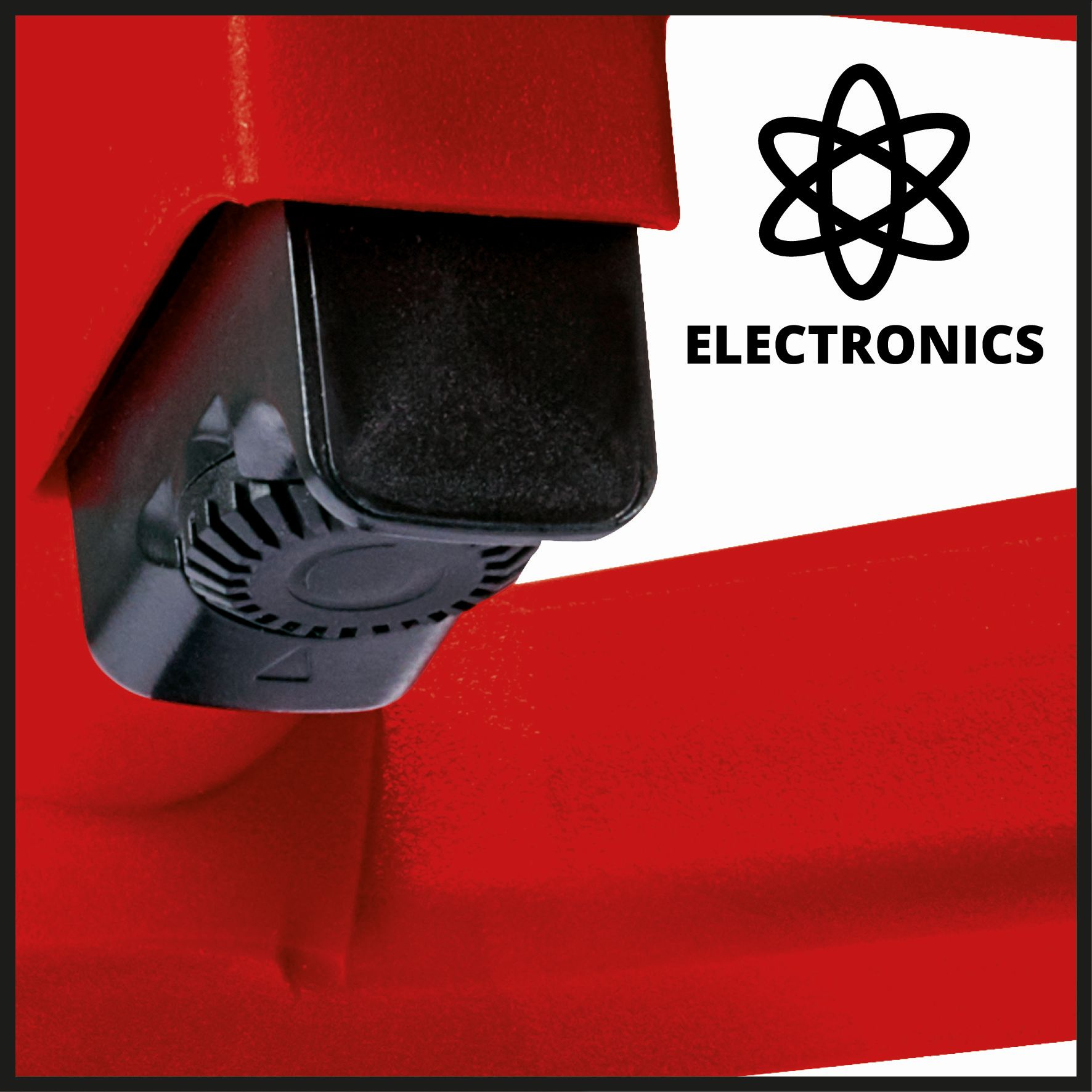 Parte di macchinario rossa con un componente nero e un cartello con scritto 'ELECTRONICS'.