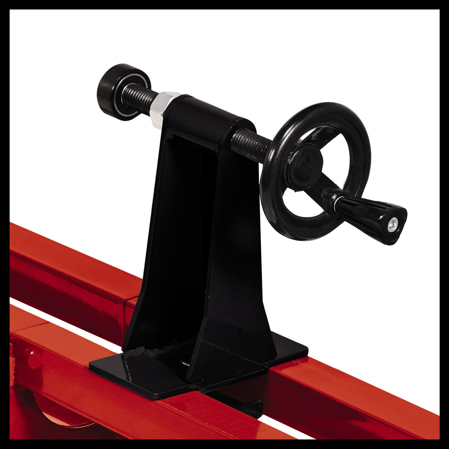 Schwarzes und rotes Metallgerät mit Griff, Schraube und Rahmen auf roter Basis.