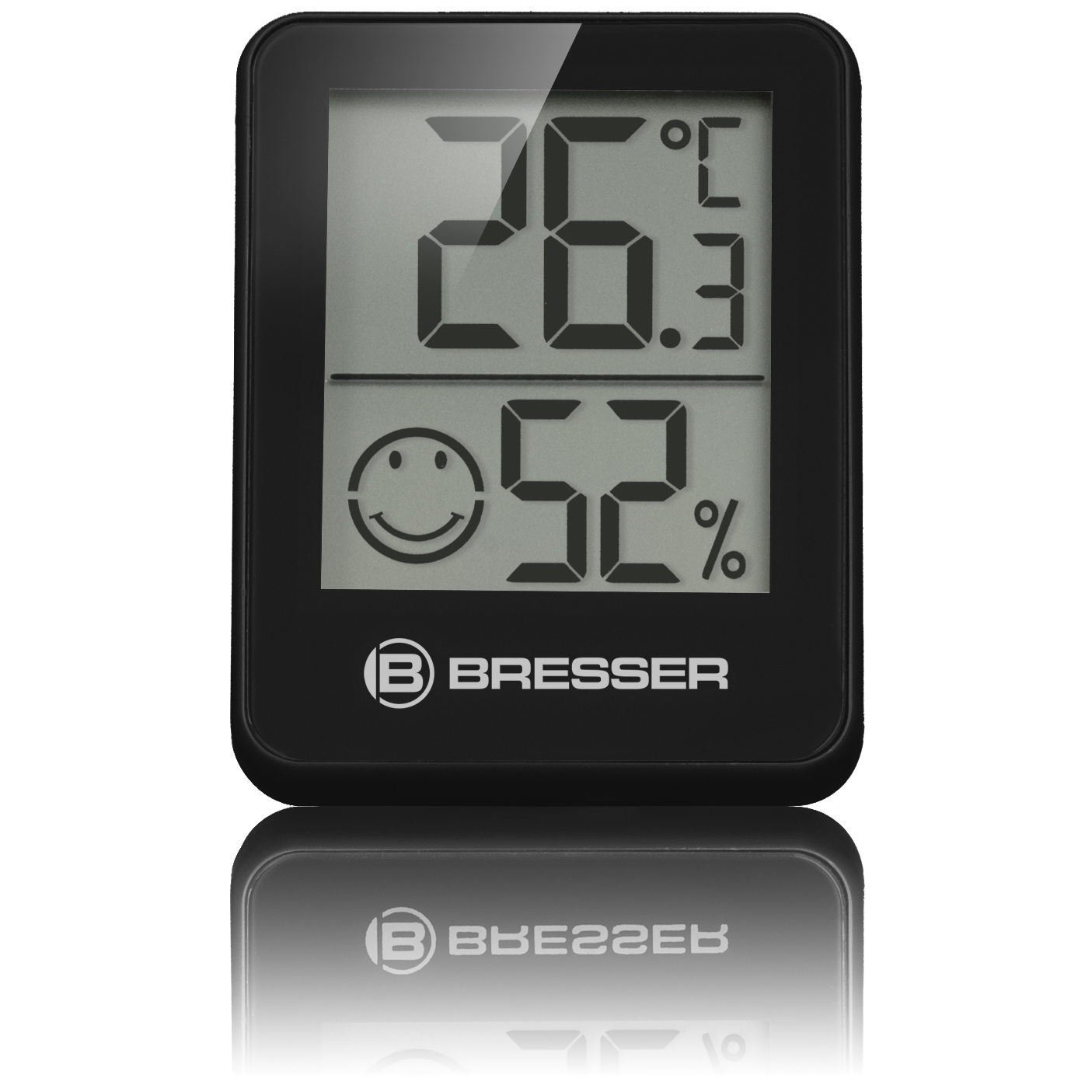 Un termómetro digital negro que muestra temperatura y humedad, con un icono de carita sonriente y logo.