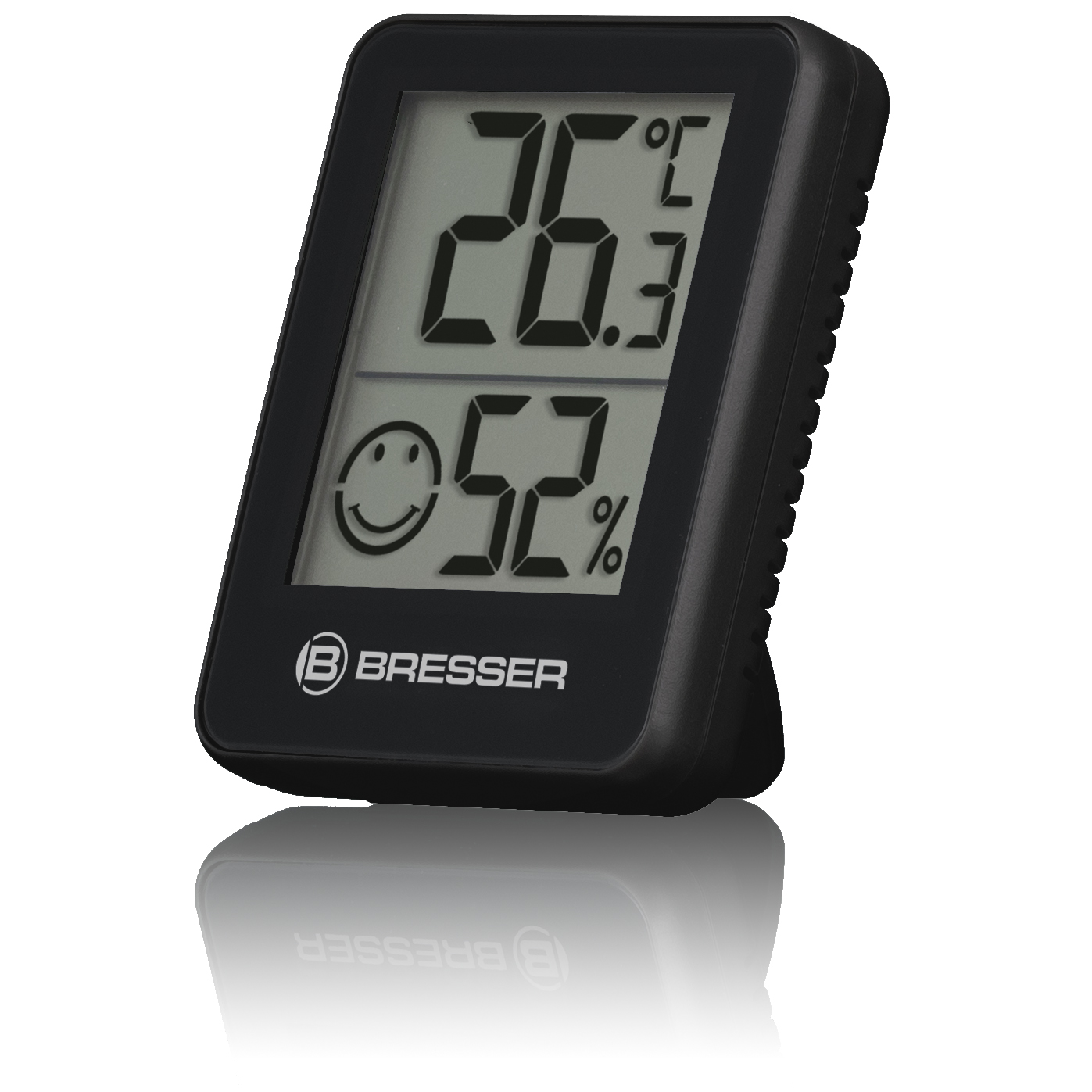 Termómetro digital negro que muestra 26,3 grados Celsius y 52% de humedad, con una carita sonriente.