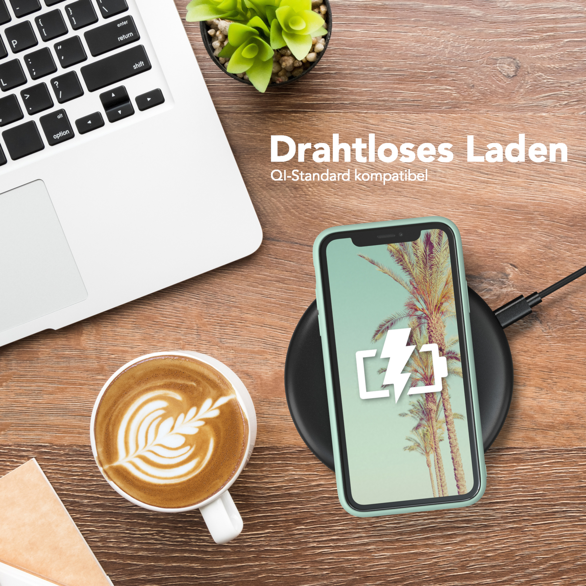 Ein Telefon in einer Hülle auf einem kabellosen Ladegerät, ein Laptop und ein Kaffee. Text: 'Kabelloses Laden'.