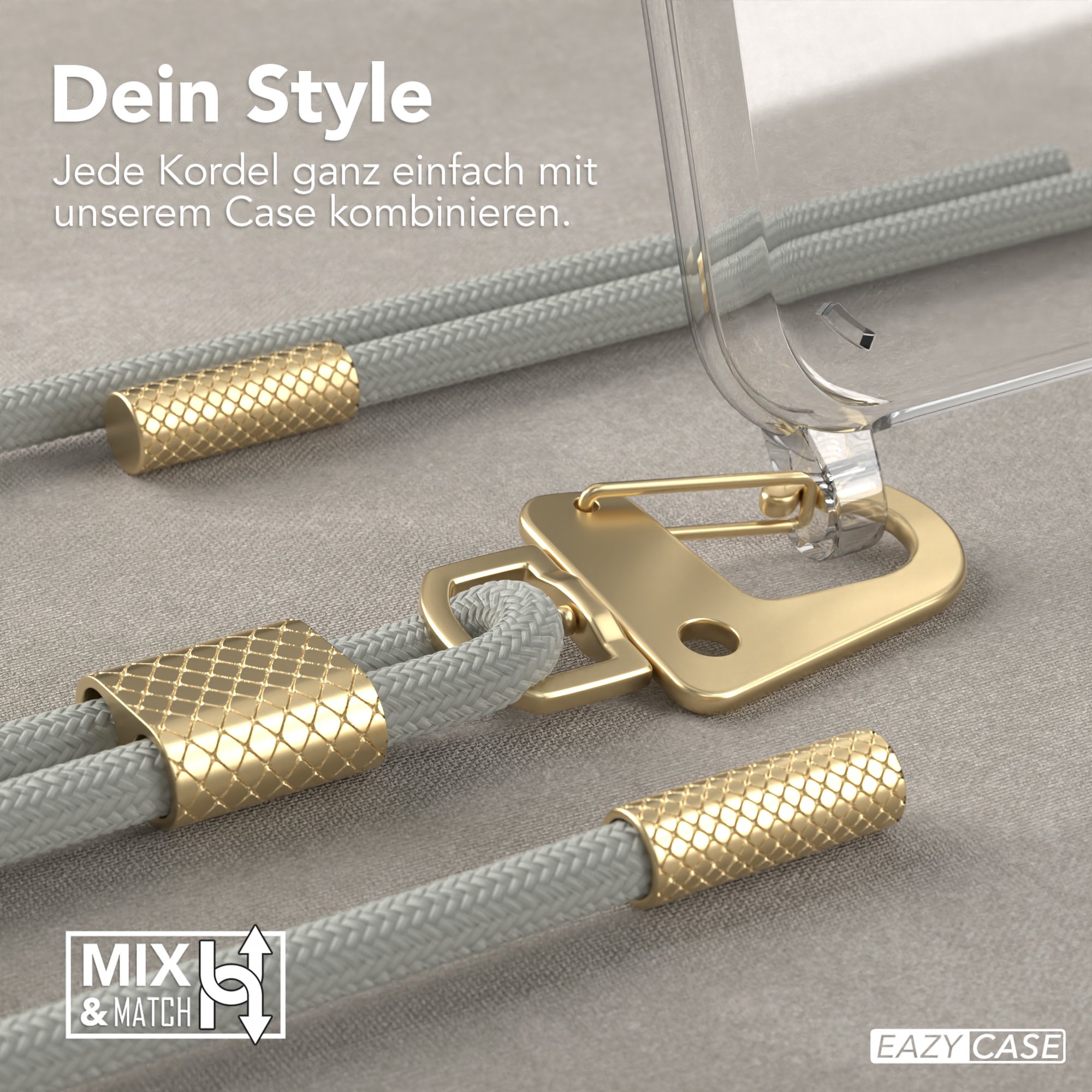 Detail eines goldenen Handybandes. Das Handyband hängt an einer transparenten Handyhülle.